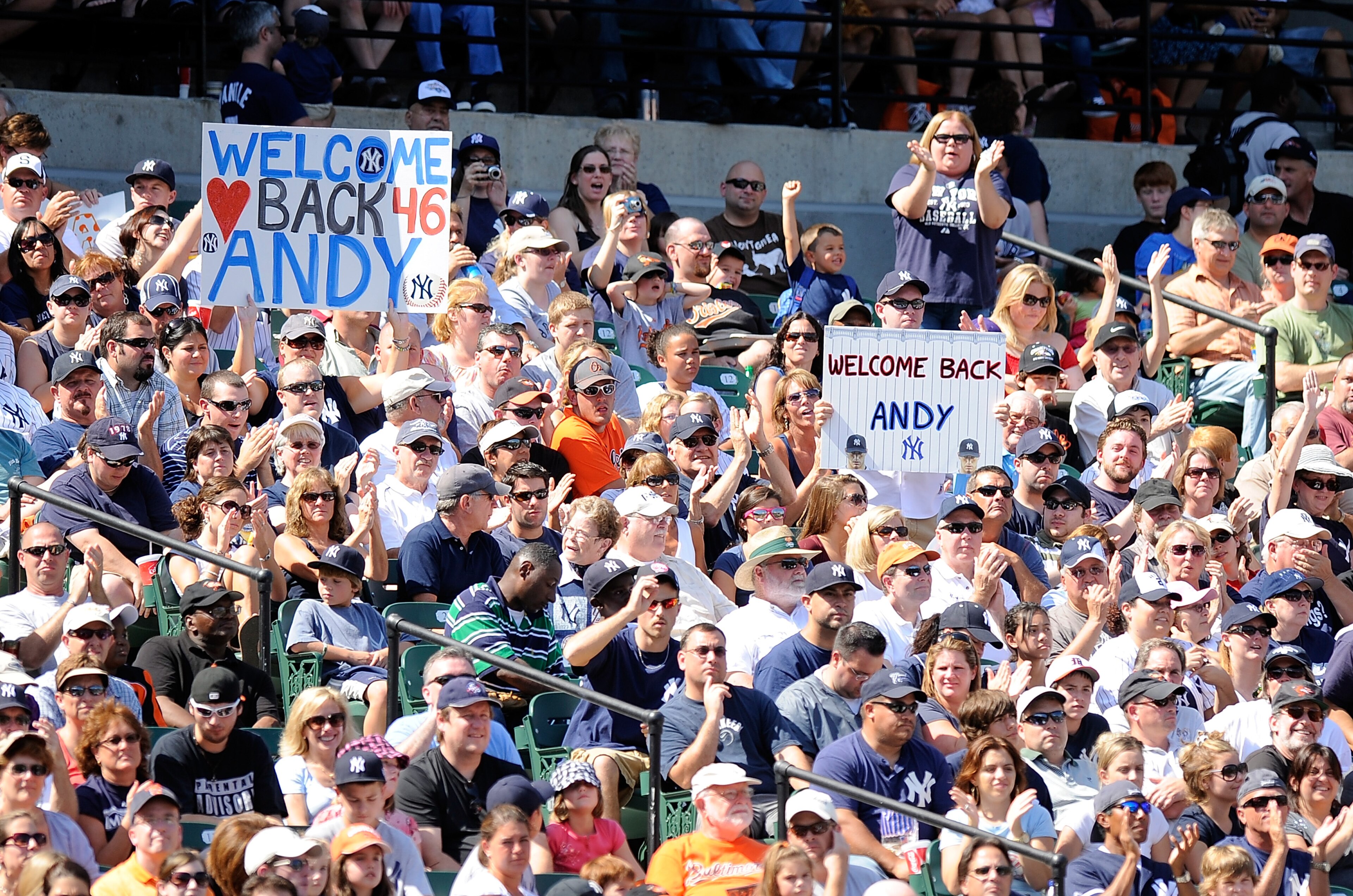 BALTIMORE - SEPTEMBER 19:  Fans hold up signs for Andy Pettitte #46 of the New York Yankees during the game against the Baltimore Orioles at Camden Yards on September 19, 2010 in Baltimore, Maryland.  (Photo by Greg Fiume/Getty Images)