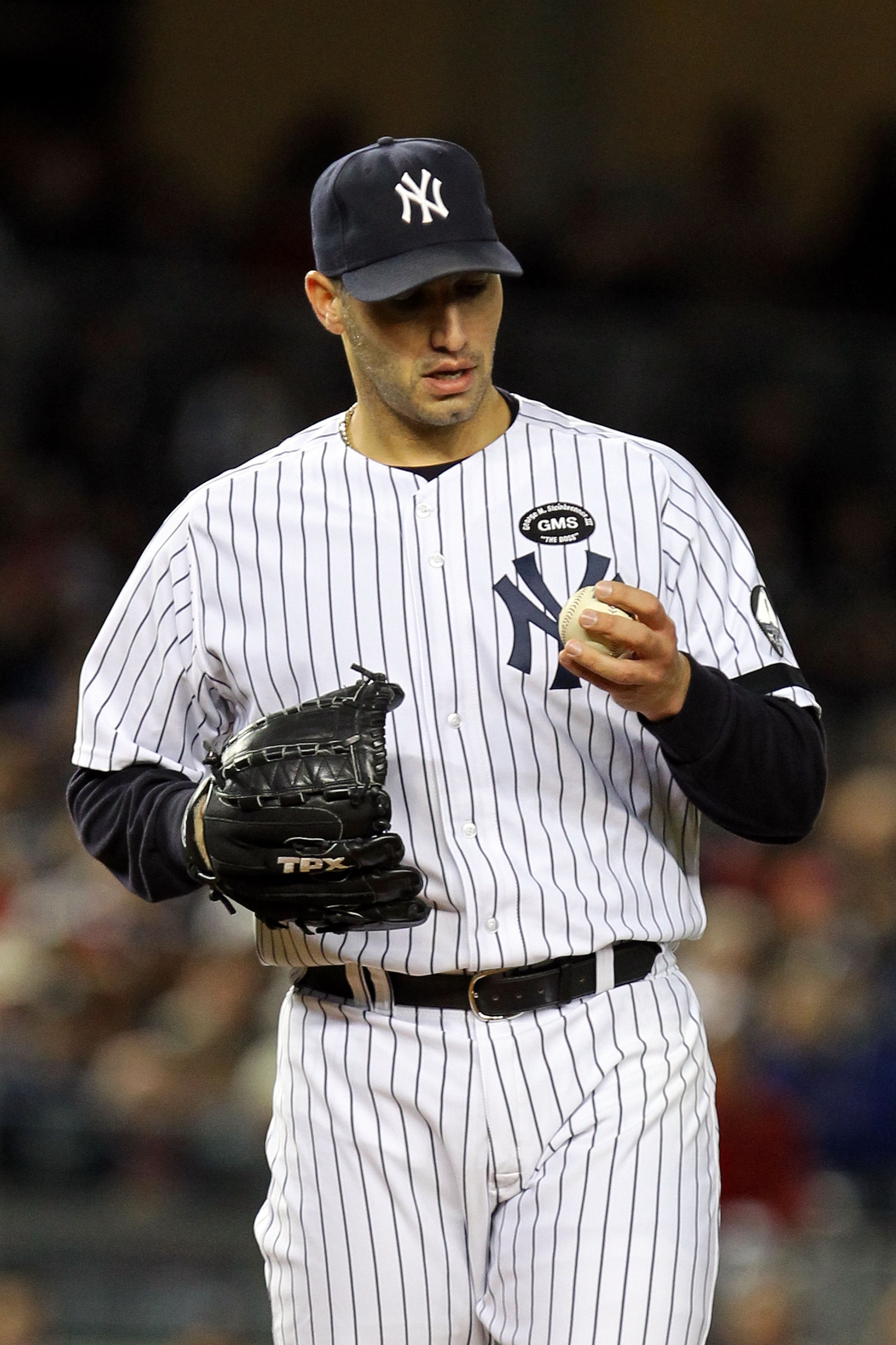 NEW YORK - OCTOBER 18: Starting pitcher Andy Pettitte #46 of the New York Yankees looks at the ball against the Texas Rangers in Game Three of the ALCS during the 2010 MLB Playoffs at Yankee Stadium on October 18, 2010 in New York, New York. (Photo by A NEW YORK - OCTOBER 18: Starting pitcher Andy Pettitte #46 of the New York Yankees looks at the ball against the Texas Rangers in Game Three of the ALCS during the 2010 MLB Playoffs at Yankee Stadium on October 18, 2010 in New York, New York. (Photo by A