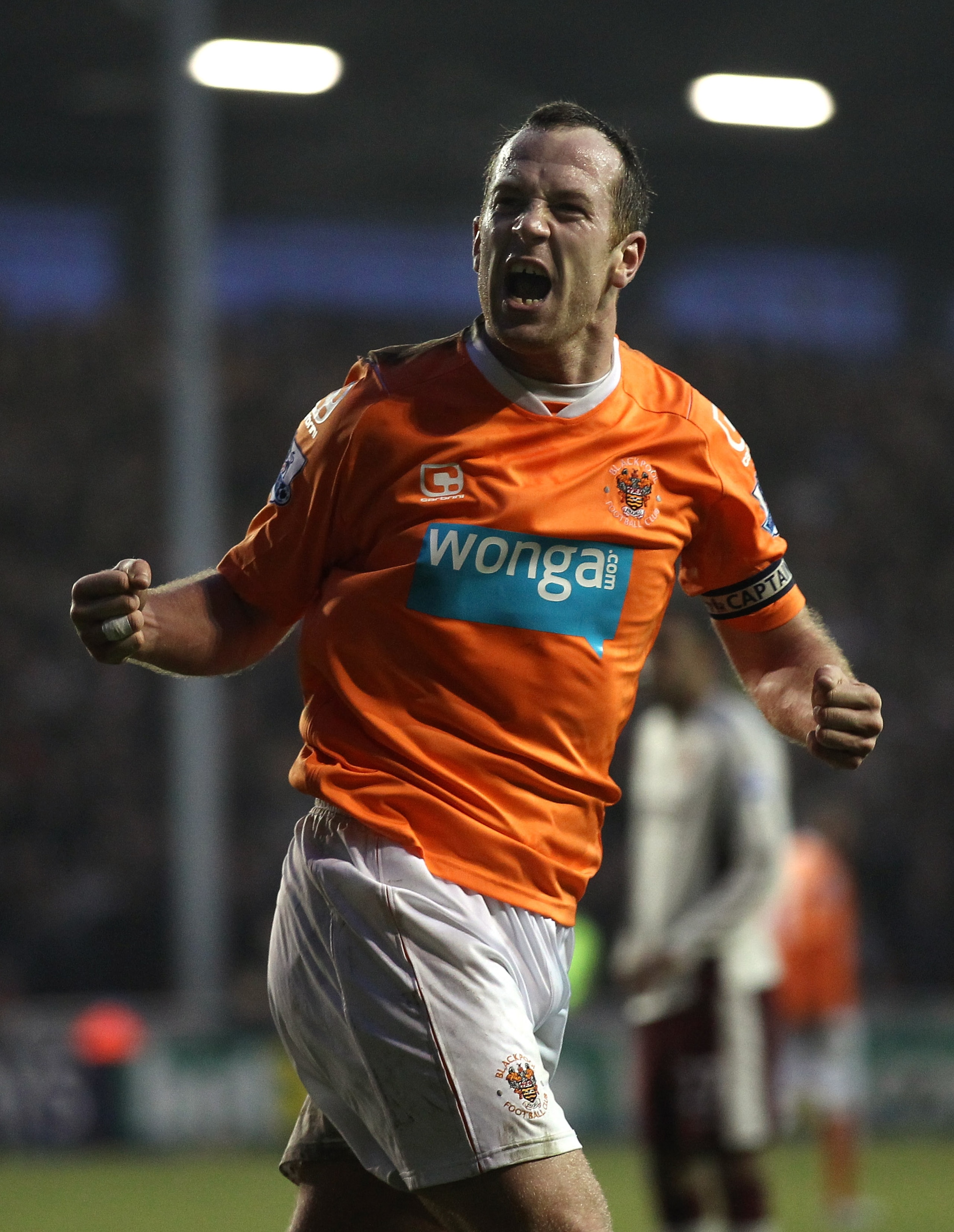 BLACKPOOL, ENGLAND - JANUARY 22:  Charlie Adam of Blackpool celebrates after scoring his goal from the penalty spot during the Barclays Premier League match between Blackpool and Sunderland at Bloomfield Road on January 22, 2011 in Blackpool, England.  (P