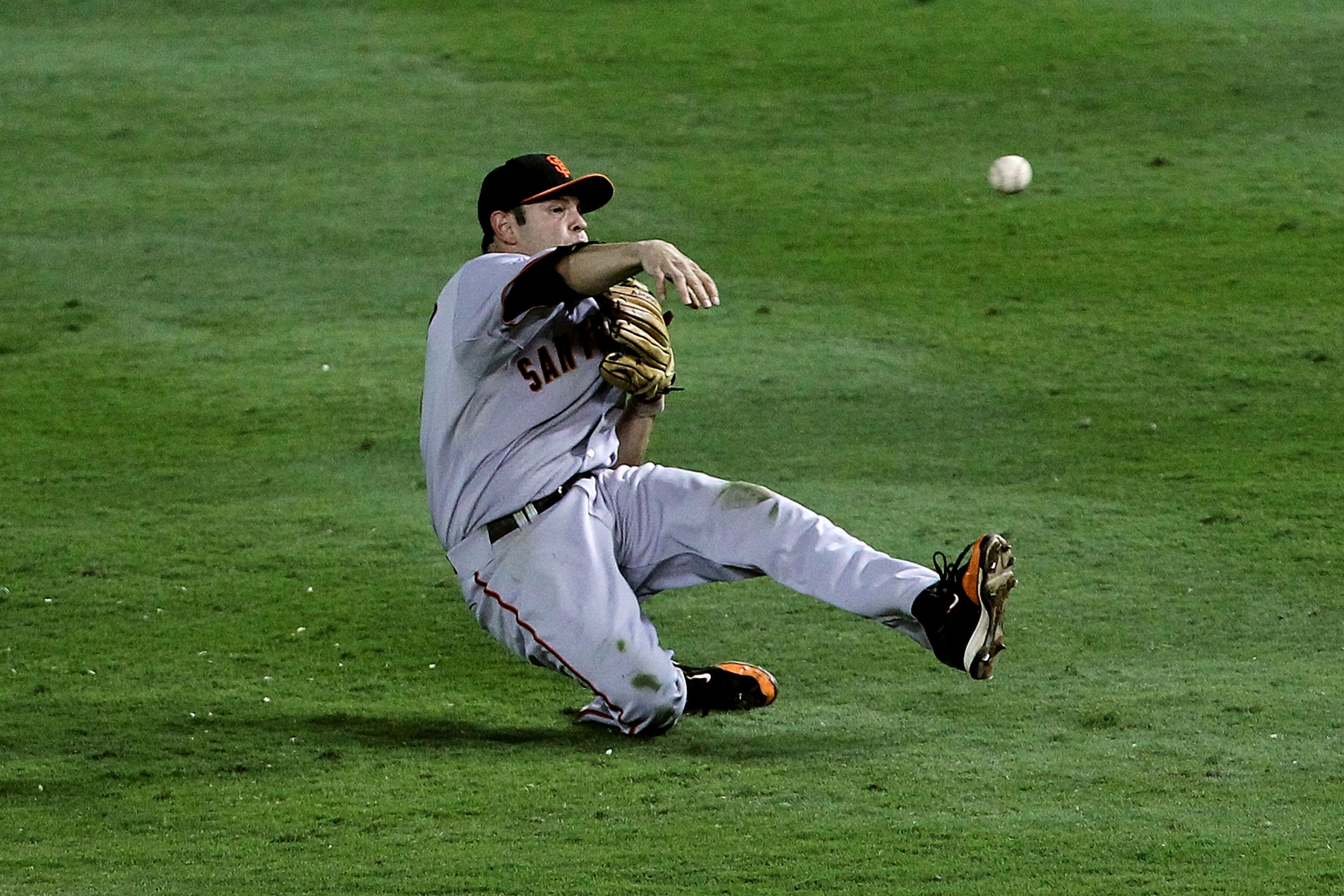 ARLINGTON, TX - OCTOBER 31:  Freddy Sanchez #21 of the San Francisco Giants fails to throw out Michael Young #10 of the Texas Rangers on infield single in the fourth inning of Game Four of the 2010 MLB World Series at Rangers Ballpark in Arlington on Octo