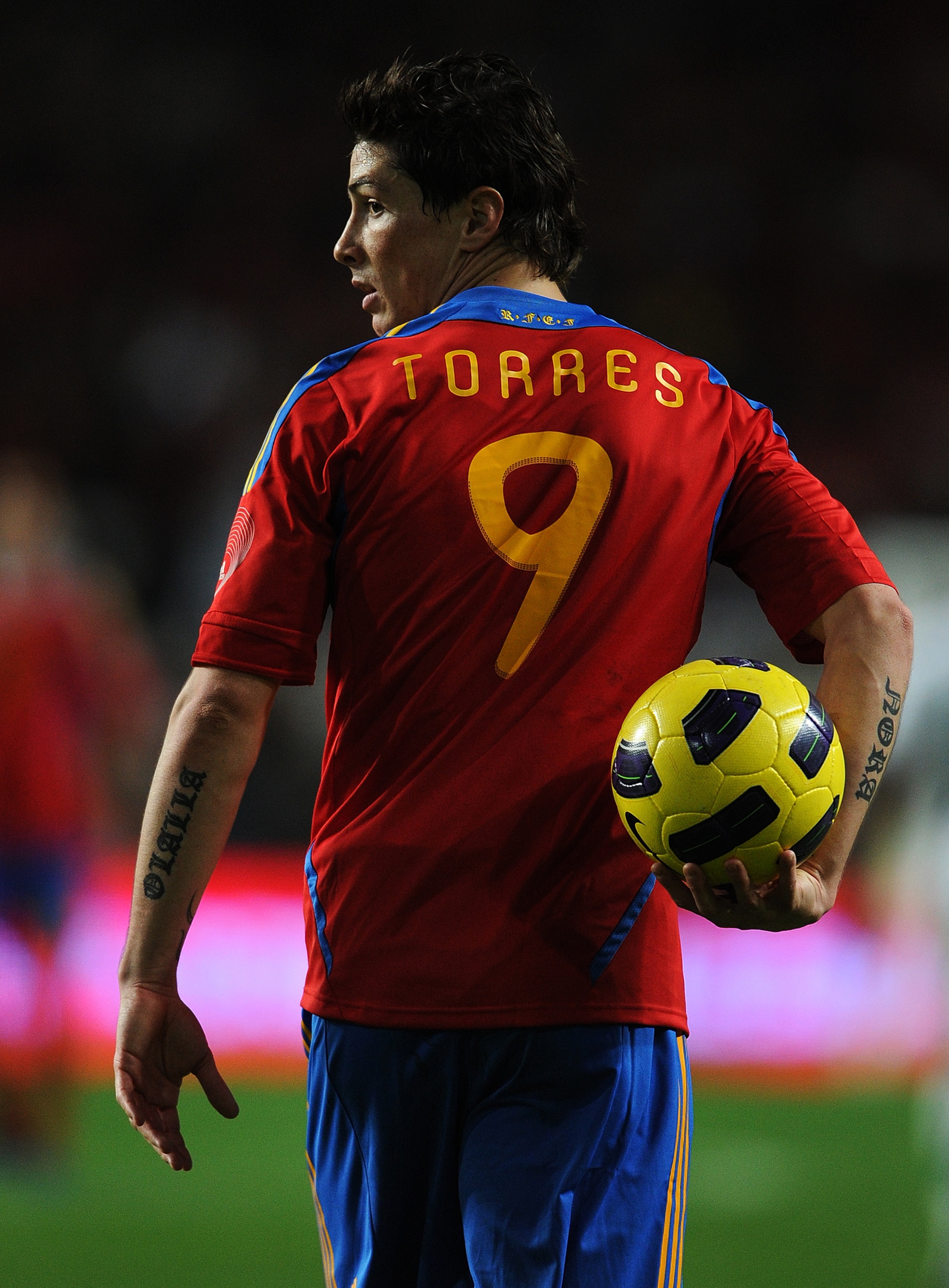 LISBON, PORTUGAL - NOVEMBER 17:  Fernando Torres of Spain walks with the ball during the International Friendly match between Portugal and Spain at the Estadio da Luz on November 17, 2010 in Lisbon, Portugal. Spain lost the match 4-0.  (Photo by Jasper Ju