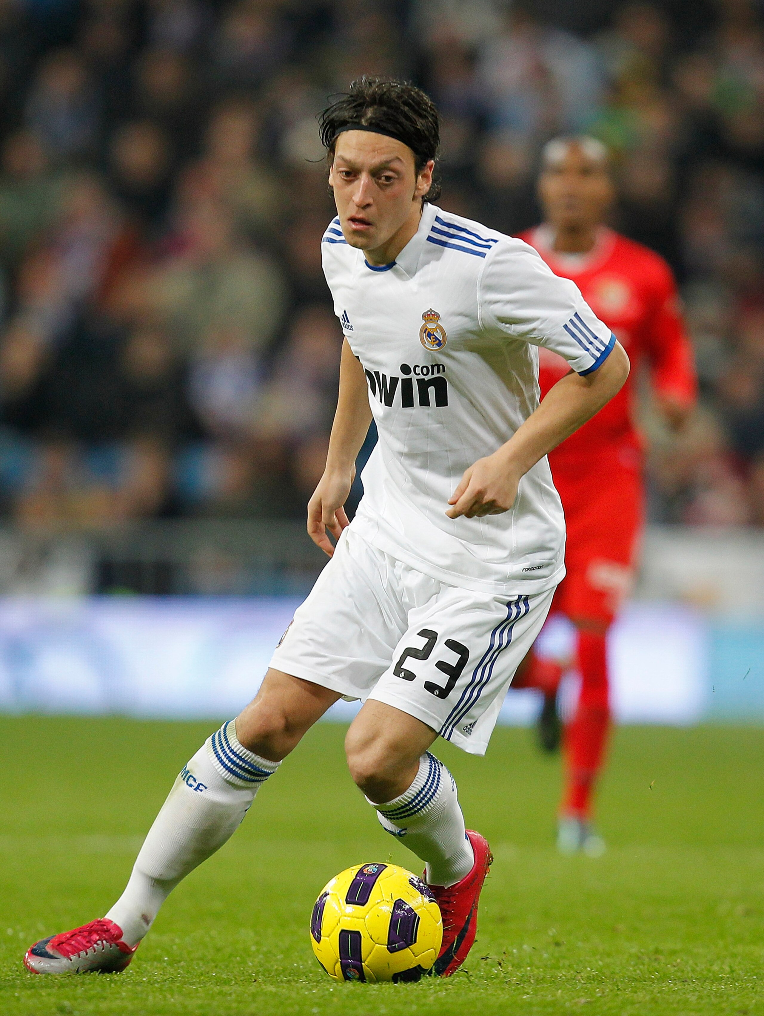 MADRID, SPAIN - DECEMBER 19:  Mezut Ozil of Real Madrid in action during the La Liga match between Real Madrid and Sevilla at Estadio Santiago Bernabeu on December 19, 2010 in Madrid, Spain. Real Madrid won the match 1-0.  (Photo by Angel Martinez/Getty I