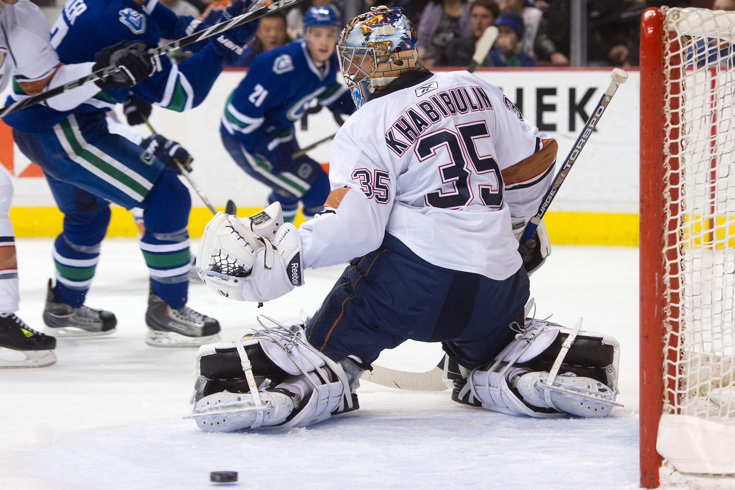 VANCOUVER, CANADA - JANUARY 7: Goalie Nikolai Khabibulin #35 of the Edmonton Oilers watches the puck go wide of the net during the second period in NHL action against the Vancouver Canucks at Rogers Arena January 7, 2011 in Vancouver, BC, Canada.  (Photo