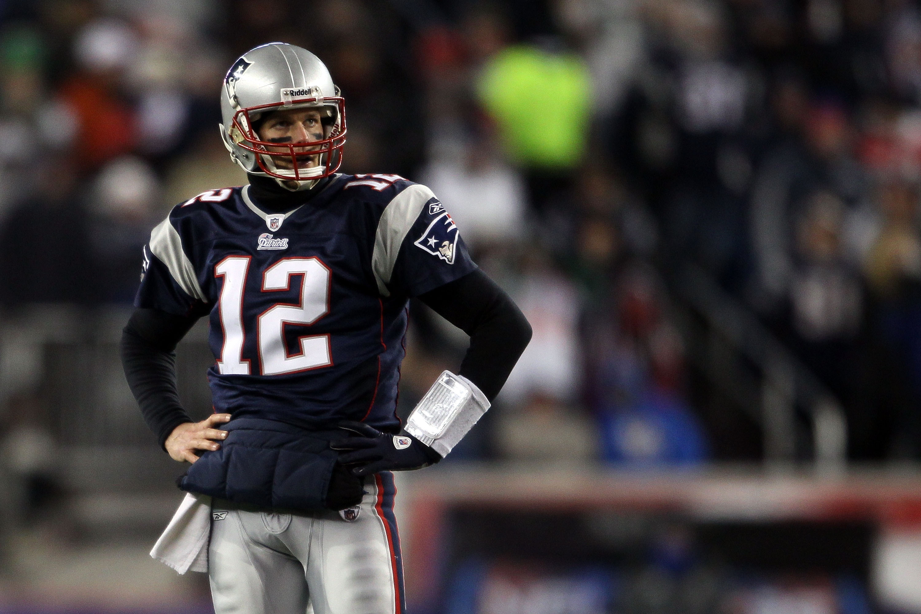 FOXBORO, MA - JANUARY 16:  Tom Brady #12 of the New England Patriots looks on near the end of their 28 to 21 loss to the New York Jets in their 2011 AFC divisional playoff game at Gillette Stadium on January 16, 2011 in Foxboro, Massachusetts.  (Photo by 