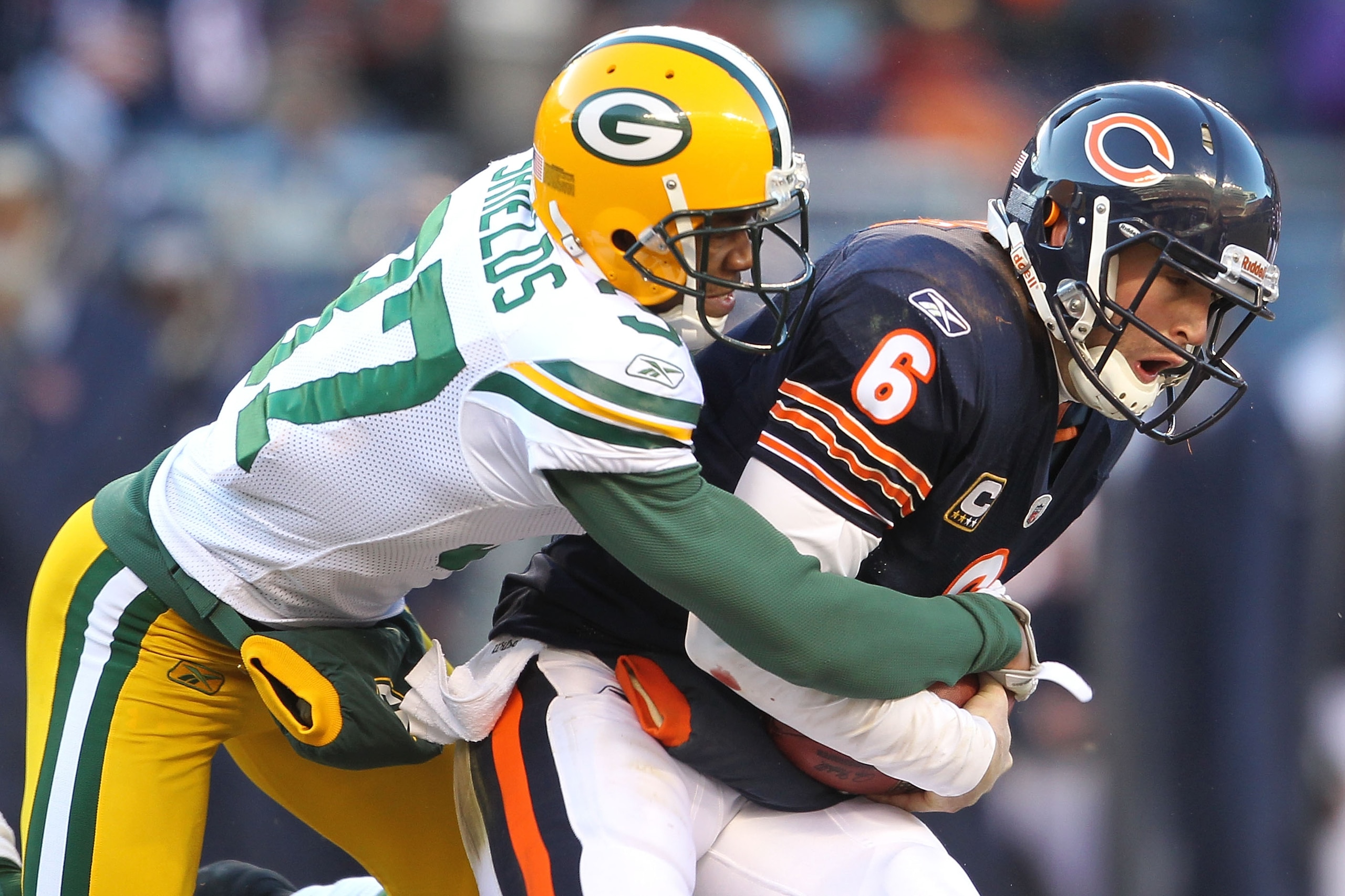 CHICAGO, IL - JANUARY 23:  Sam Shields #37 of the Green Bay Packers sacks quarterback Jay Cutler #6 of the Chicago Bears in the second quarter in the NFC Championship Game at Soldier Field on January 23, 2011 in Chicago, Illinois.  (Photo by Andy Lyons/Ge