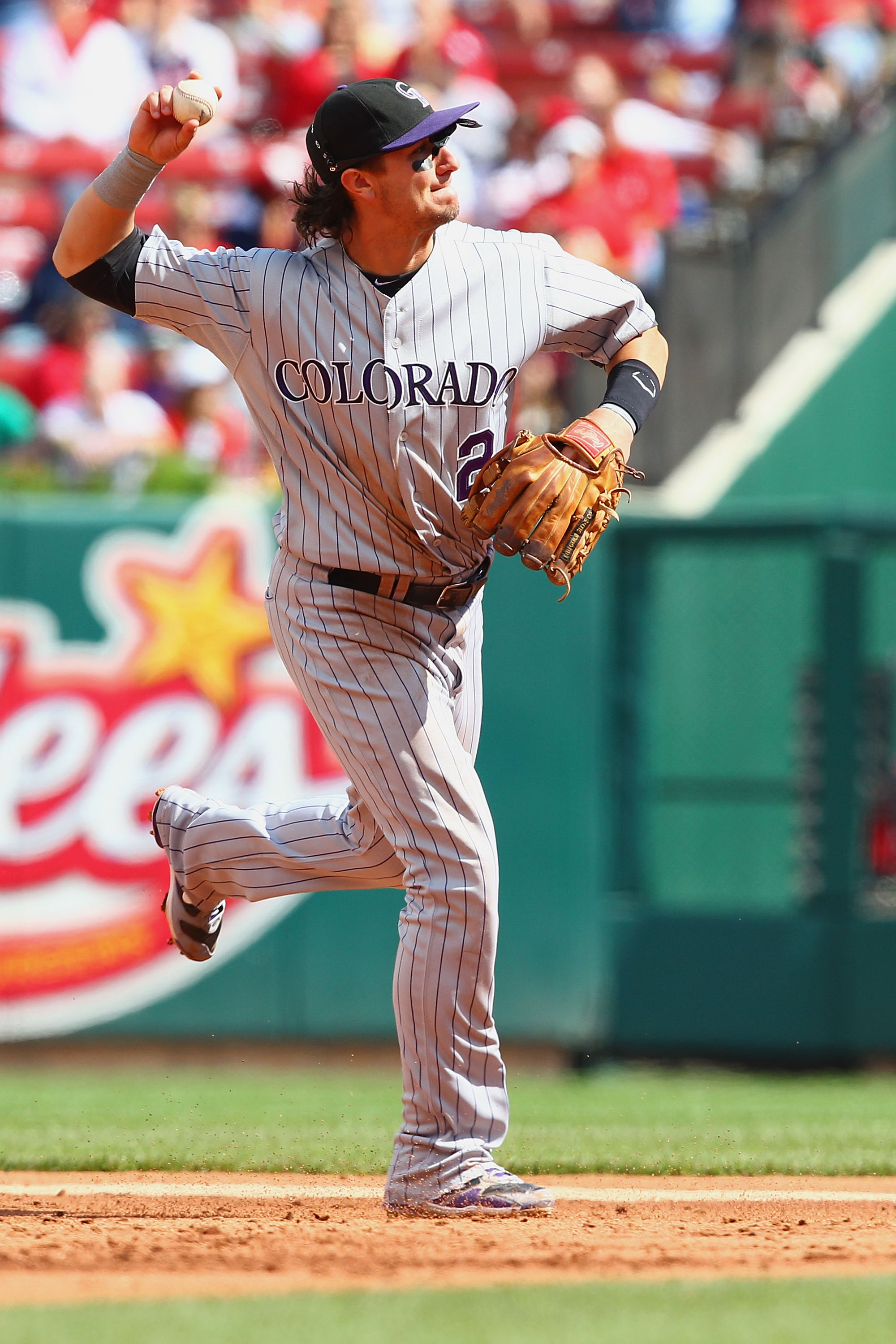 ST. LOUIS - OCTOBER 2: Troy Tulowitzki #2 of the Colorado Rockies throws to first base against the St. Louis Cardinals at Busch Stadium on October 2, 2010 in St. Louis, Missouri.  The Cardinals beat the Rockies 1-0 in 11 innings.  (Photo by Dilip Vishwana