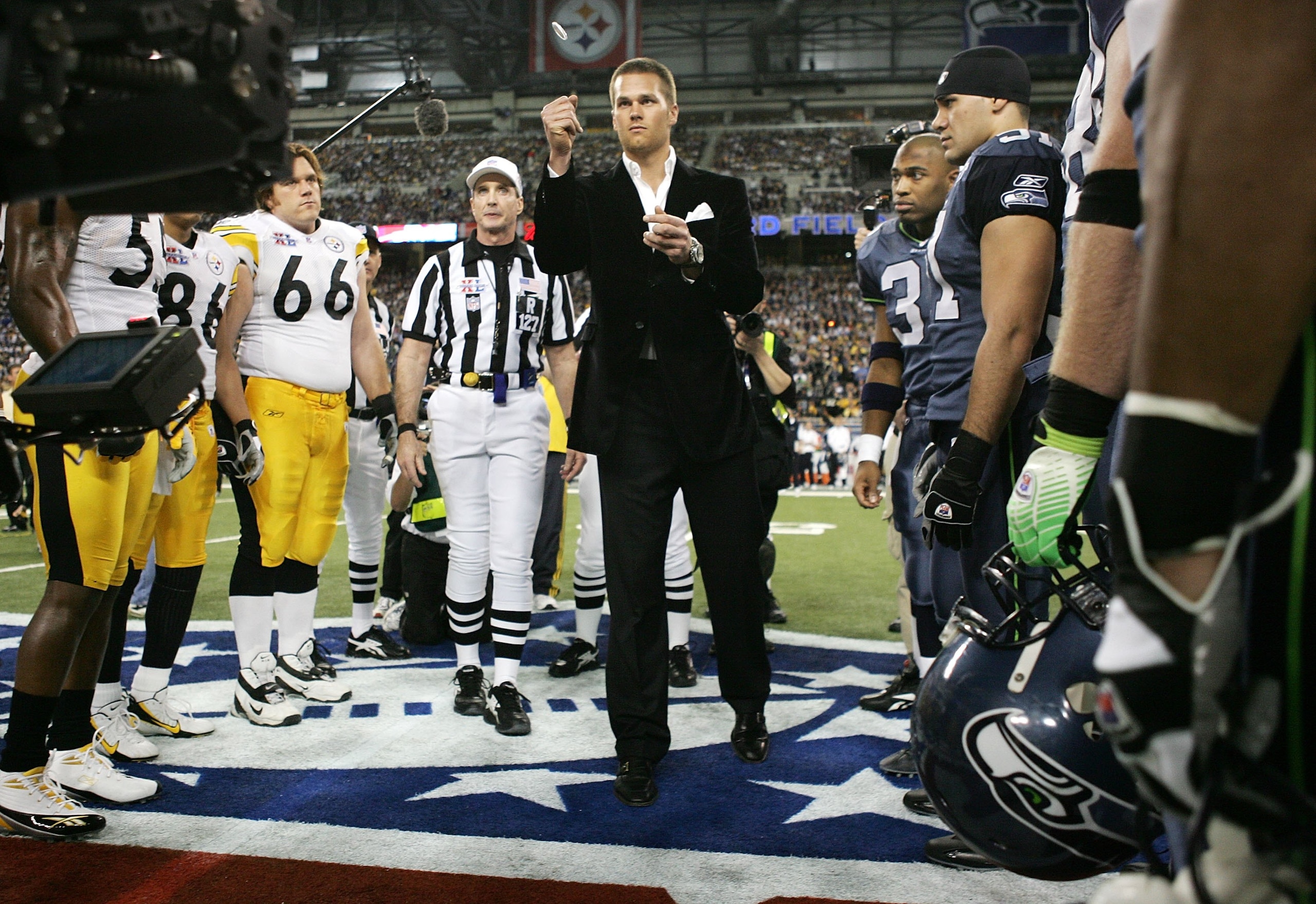 DETROIT - FEBRUARY 05:  Super Bowl MVP and New England Patriots quarterback Tom Brady performs the coin toss before the start of Super Bowl XL between the Pittsburgh Steelers and Seattle Seahawks at Ford Field on February 5, 2006 in Detroit, Michigan.  (P