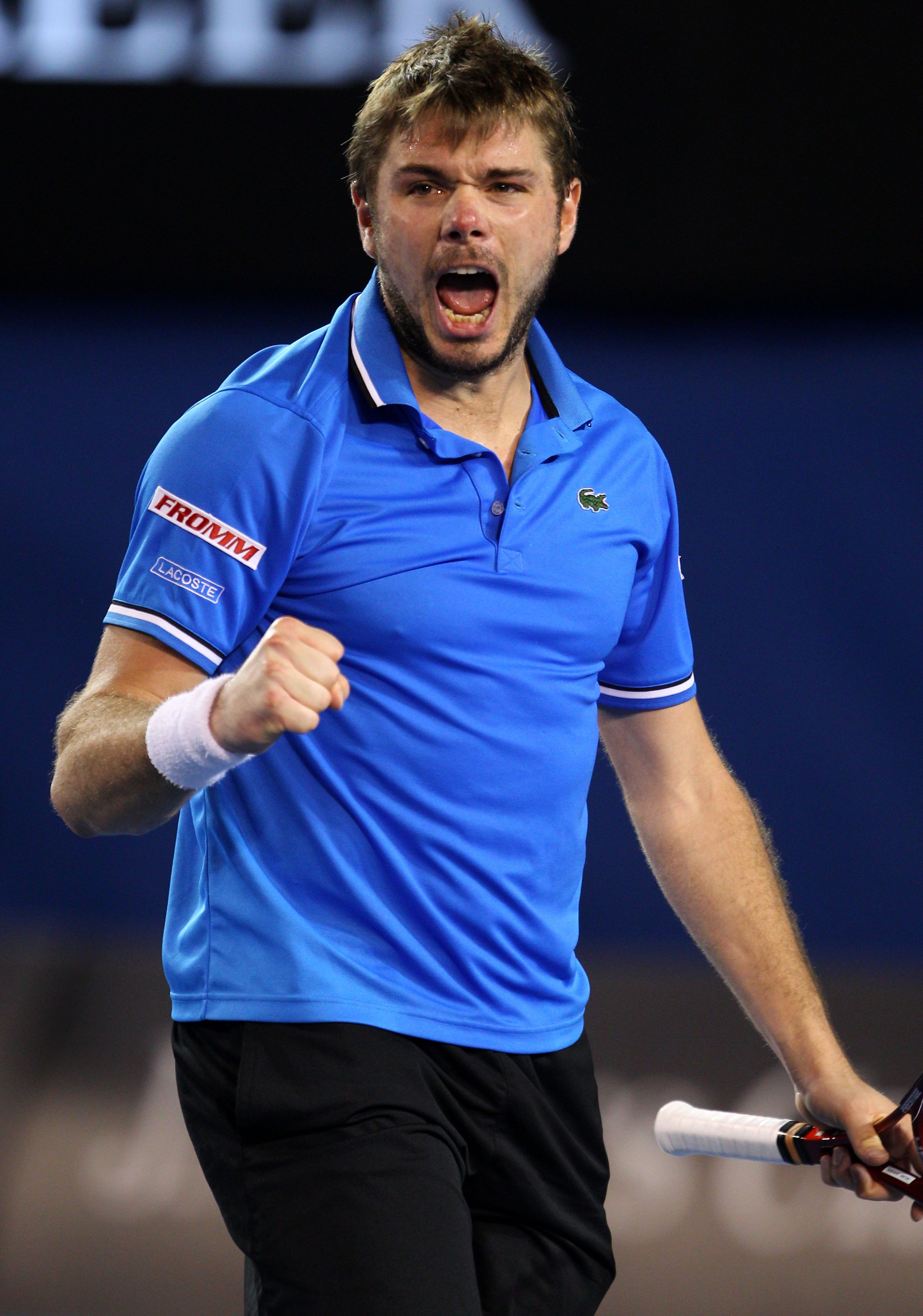 MELBOURNE, AUSTRALIA - JANUARY 23:  Stanislas Wawrinka of Switzerland celebrates match point in his fourth round match against Andy Roddick of the United States of America during day seven of the 2011 Australian Open at Melbourne Park on January 23, 2011