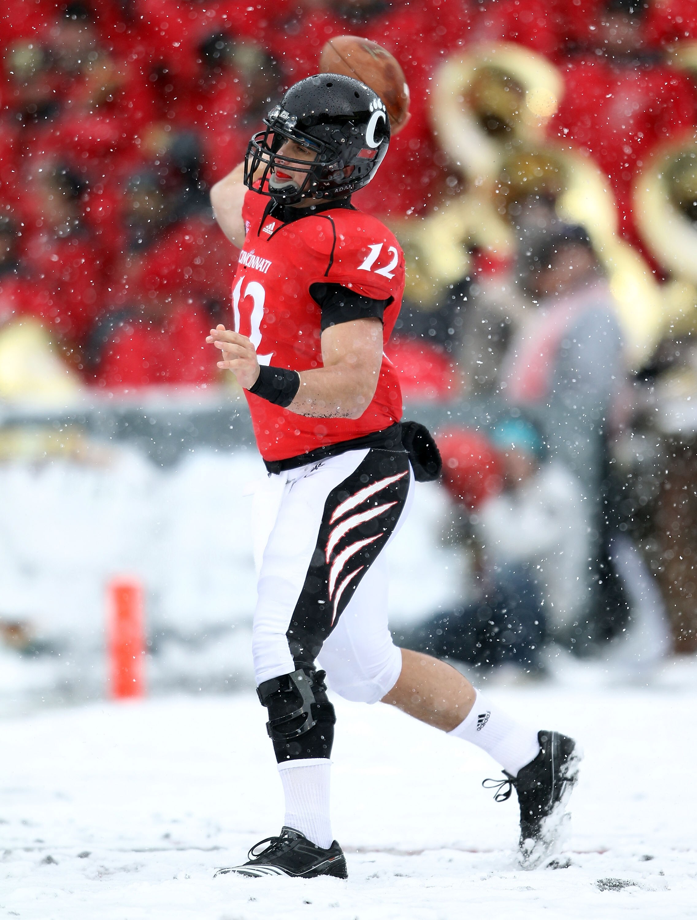 CINCINNATI, OH - DECEMBER 04:  Zach Collaros #12 of the Cincinnati Bearcats throws the ball  during the Big East Conference game against the Pittsburgh Panthers at Nippert Stadium on December 4, 2010 in Cincinnati, Ohio. Pittsburgh won 28-10.  (Photo by A