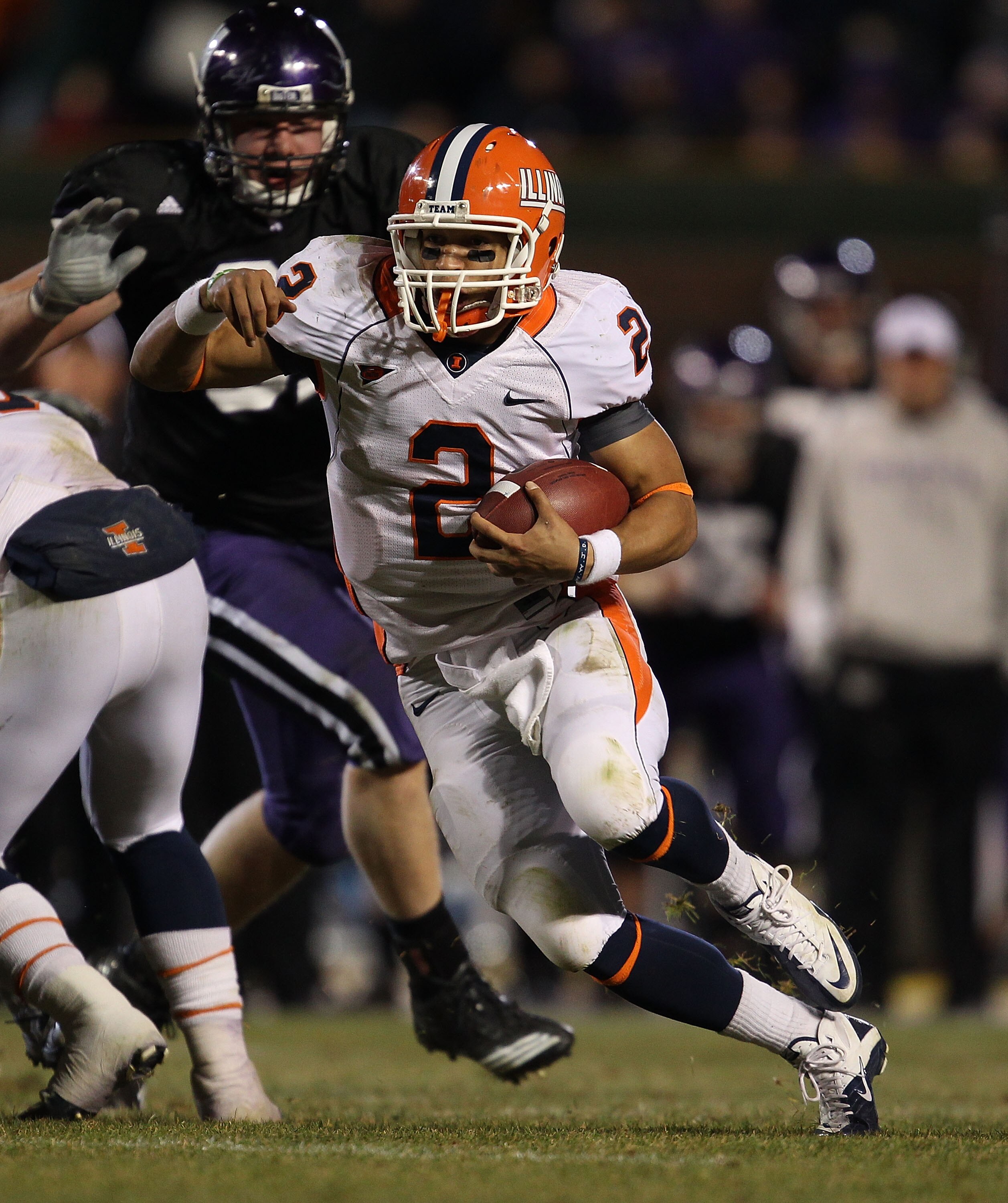 CHICAGO, IL - NOVEMBER 20: Nathan Scheelhasse #2 of the Illinois Fighting Illini runs against the Northwestern Wildcats during a game played at Wrigley Field on November 20, 2010 in Chicago, Illinois. Illinois defeated Northwestern 48-27. (Photo by Jonath