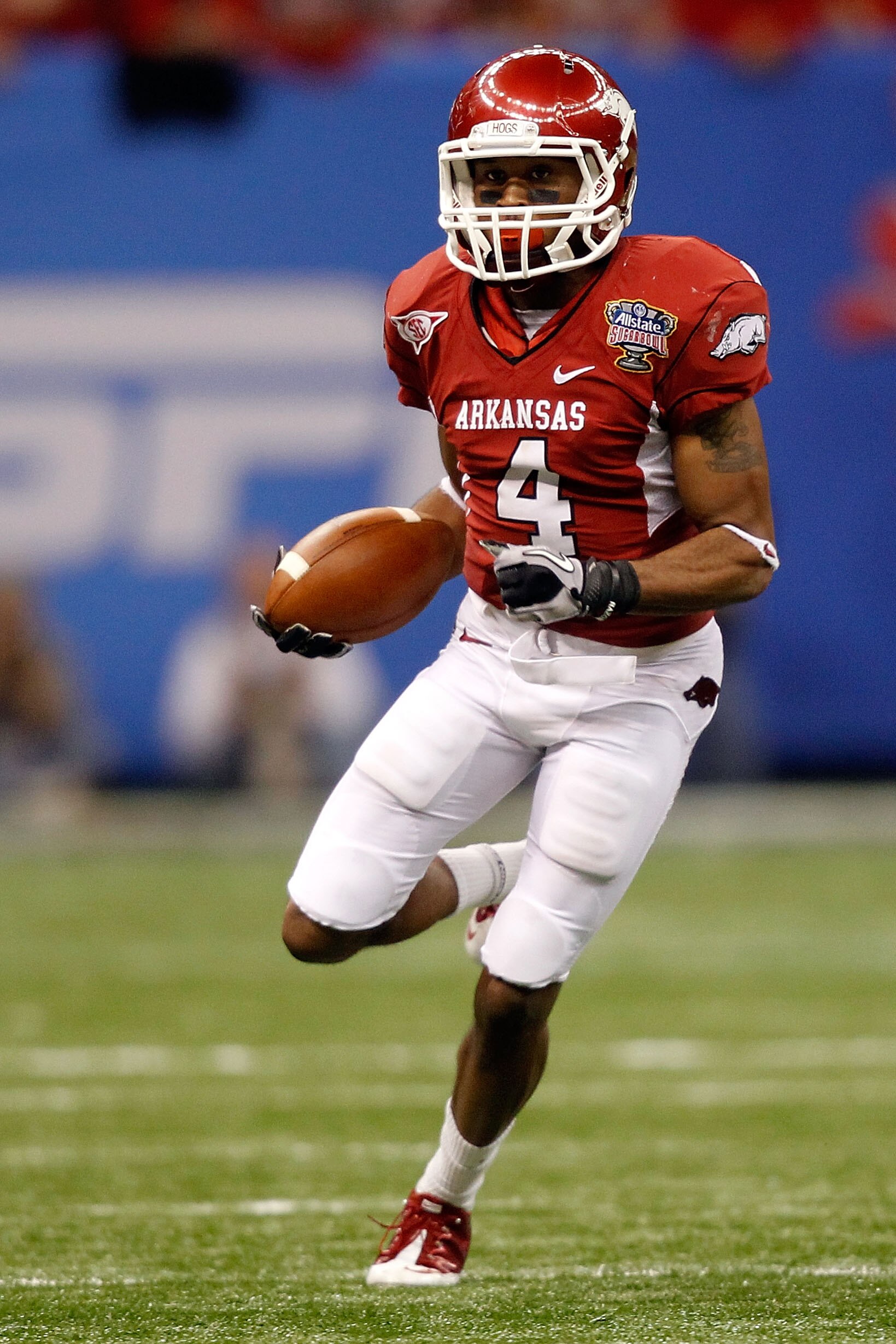 NEW ORLEANS, LA - JANUARY 04:  Jarius Wright #4 of the Arkansas Razorbacks runs after a catch against the Ohio State Buckeyes during the Allstate Sugar Bowl at the Louisiana Superdome on January 4, 2011 in New Orleans, Louisiana.  (Photo by Matthew Stockm