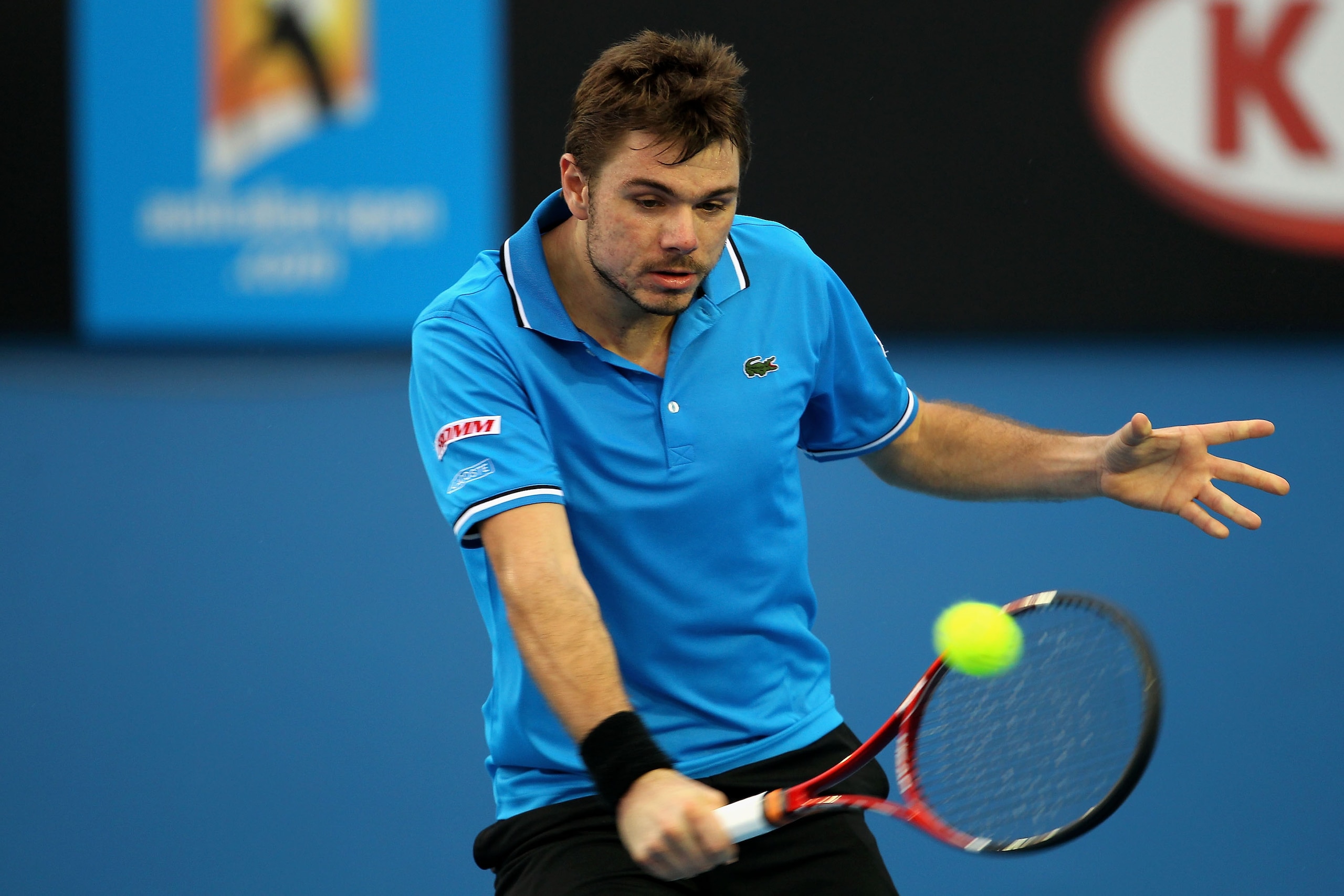 MELBOURNE, AUSTRALIA - JANUARY 17:  Stanislas Wawrinka of Switzerland plays a backhand in his first round match against Teymuraz Gabashvili of Russia during day one of the 2011 Australian Open at Melbourne Park on January 17, 2011 in Melbourne, Australia.