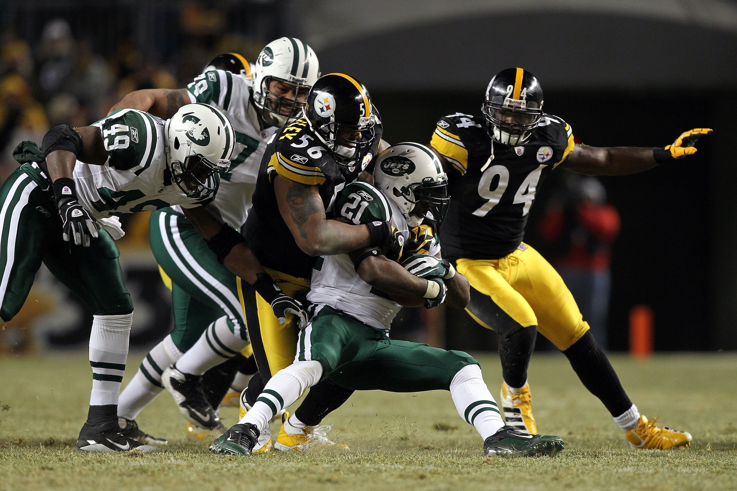 PITTSBURGH, PA - JANUARY 23: LaDainian Tomlinson #21 of the New York Jets is brought down by LaMarr Woodley #56 of the Pittsburgh Steelers during the 2011 AFC Championship game at Heinz Field on January 23, 2011 in Pittsburgh, Pennsylvania. (Photo by Al PITTSBURGH, PA - JANUARY 23: LaDainian Tomlinson #21 of the New York Jets is brought down by LaMarr Woodley #56 of the Pittsburgh Steelers during the 2011 AFC Championship game at Heinz Field on January 23, 2011 in Pittsburgh, Pennsylvania. (Photo by Al