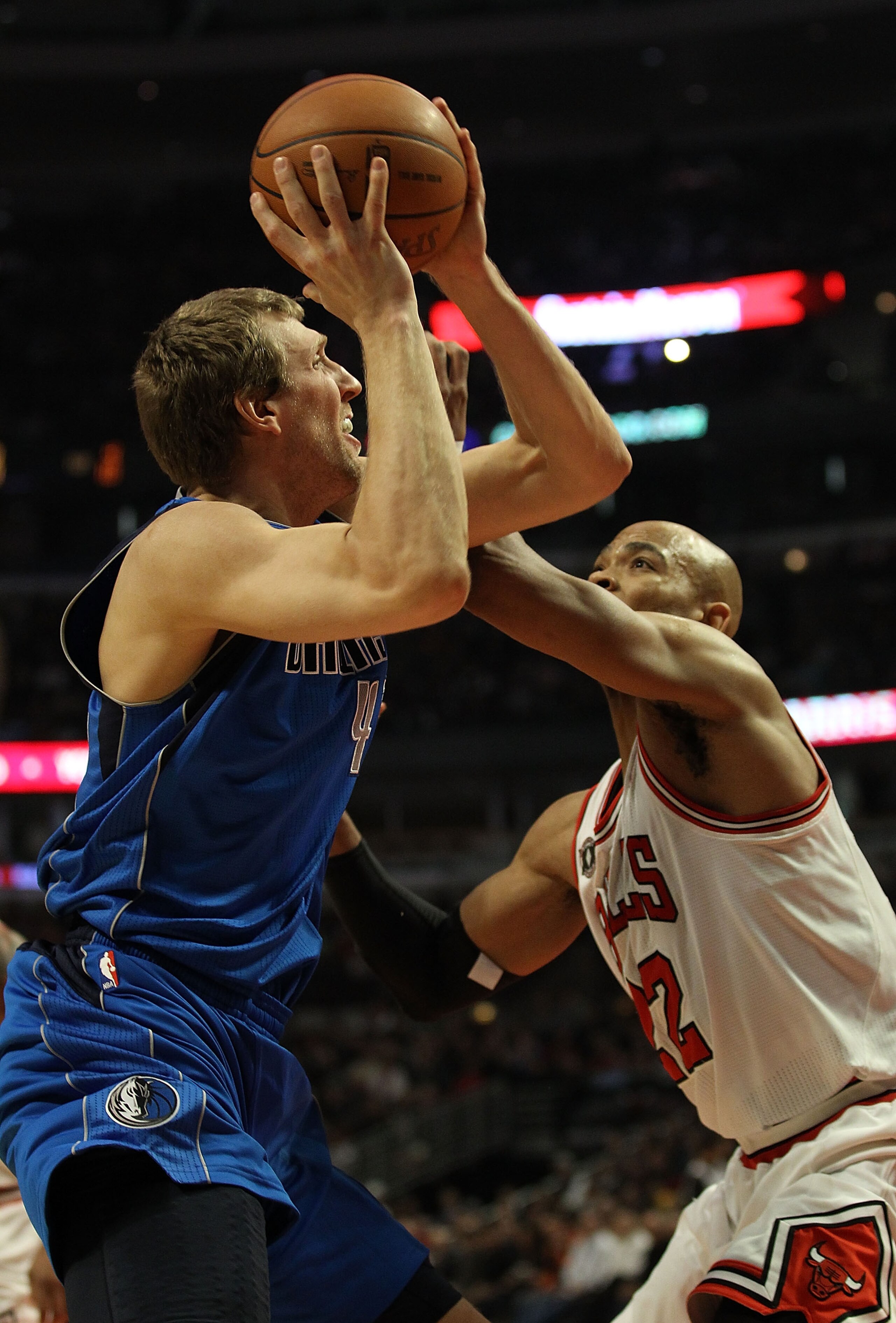 CHICAGO, IL - JANUARY 20: Dirk Nowitzki #41 of the Dallas Mavericks tries to shoot under pressure from Taj Gibson #22 of the Chicago Bulls at the United Center on January 20, 2011 in Chicago, Illinois. NOTE TO USER: User expressly acknowledges and agrees