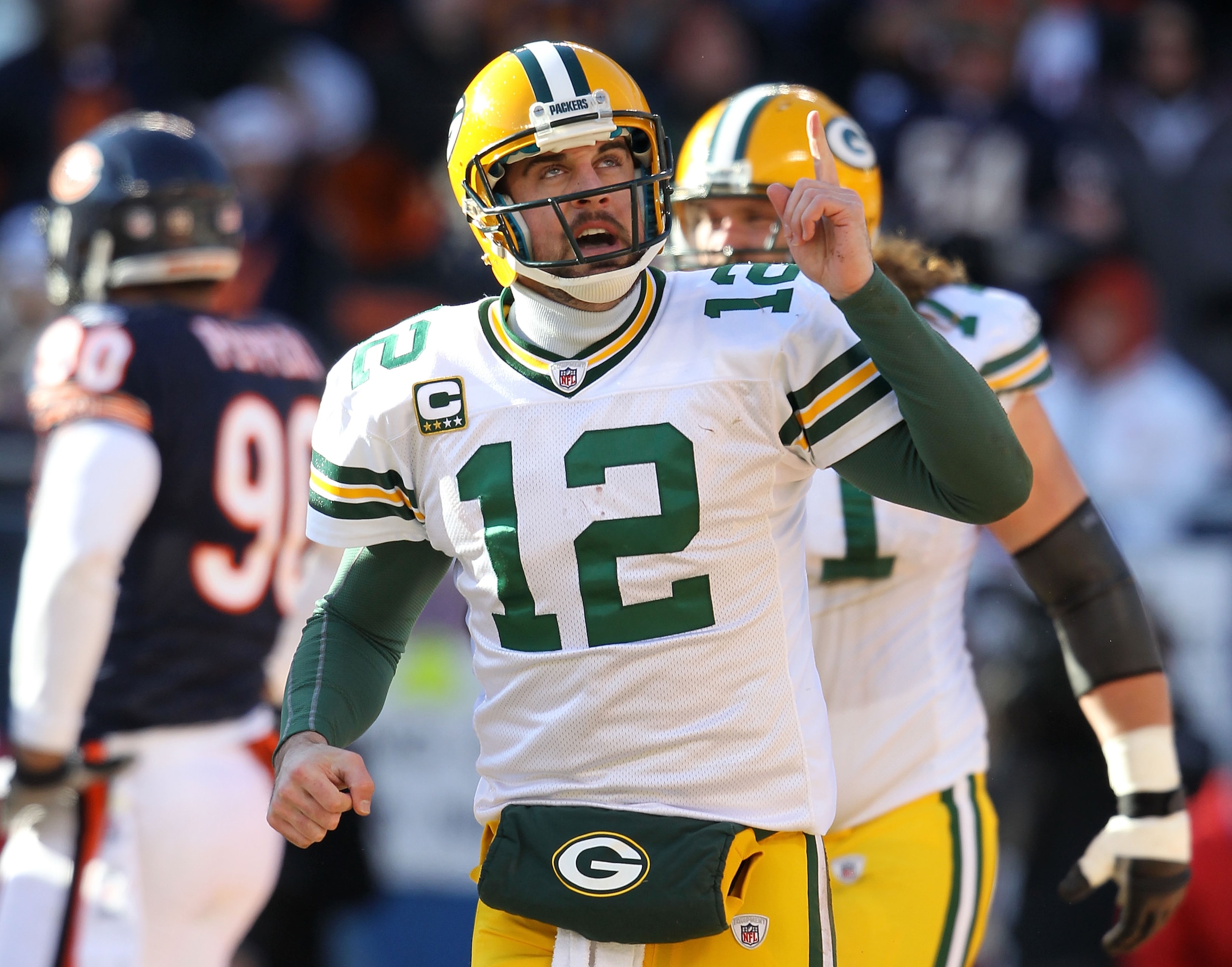 CHICAGO, IL - JANUARY 23: Quarterback Aaron Rodgers #12 of the Green Bay Packers reacts after he scores a one-yard touchdown against the Chicago Bears in the first quarter of the NFC Championship Game at Soldier Field on January 23, 2011 in Chicago, Illi CHICAGO, IL - JANUARY 23: Quarterback Aaron Rodgers #12 of the Green Bay Packers reacts after he scores a one-yard touchdown against the Chicago Bears in the first quarter of the NFC Championship Game at Soldier Field on January 23, 2011 in Chicago, Illi
