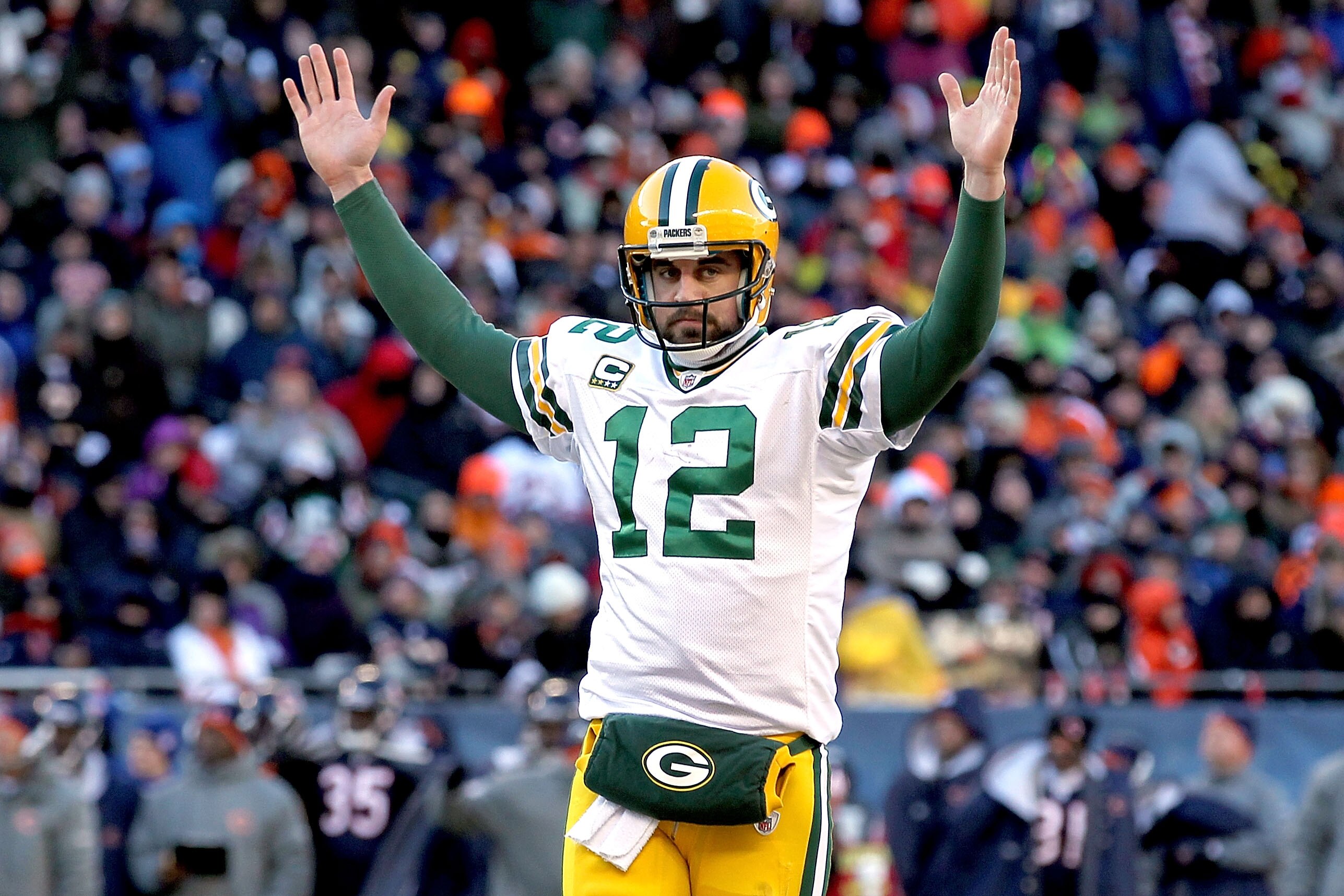 CHICAGO, IL - JANUARY 23:  Quarterback Aaron Rodgers #12 of the Green Bay Packers reacts after James Starks #44 of the Packers scores on a four-yard touchdown run in the second quarter against the Chicago Bears in the NFC Championship Game at Soldier Fiel