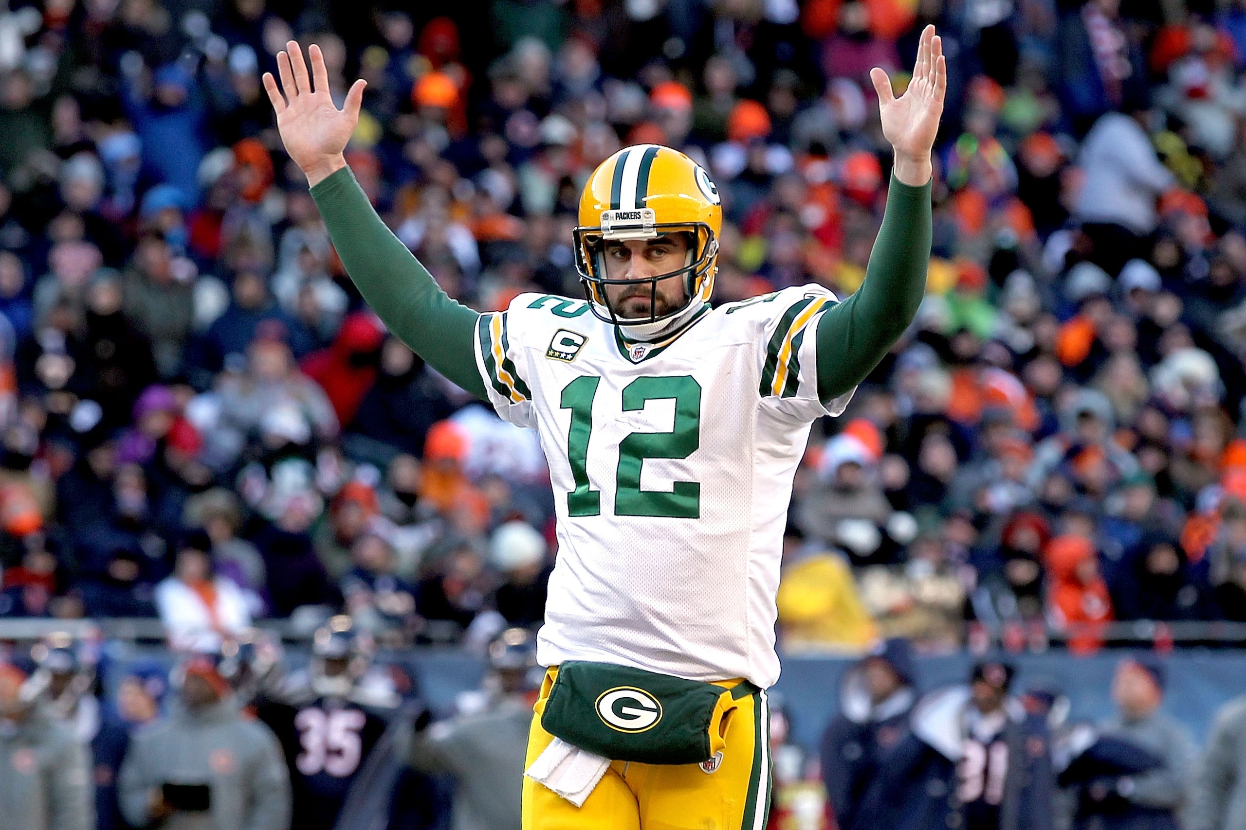 CHICAGO, IL - JANUARY 23:  Quarterback Aaron Rodgers #12 of the Green Bay Packers reacts after James Starks #44 of the Packers scores on a four-yard touchdown run in the second quarter against the Chicago Bears in the NFC Championship Game at Soldier Fiel