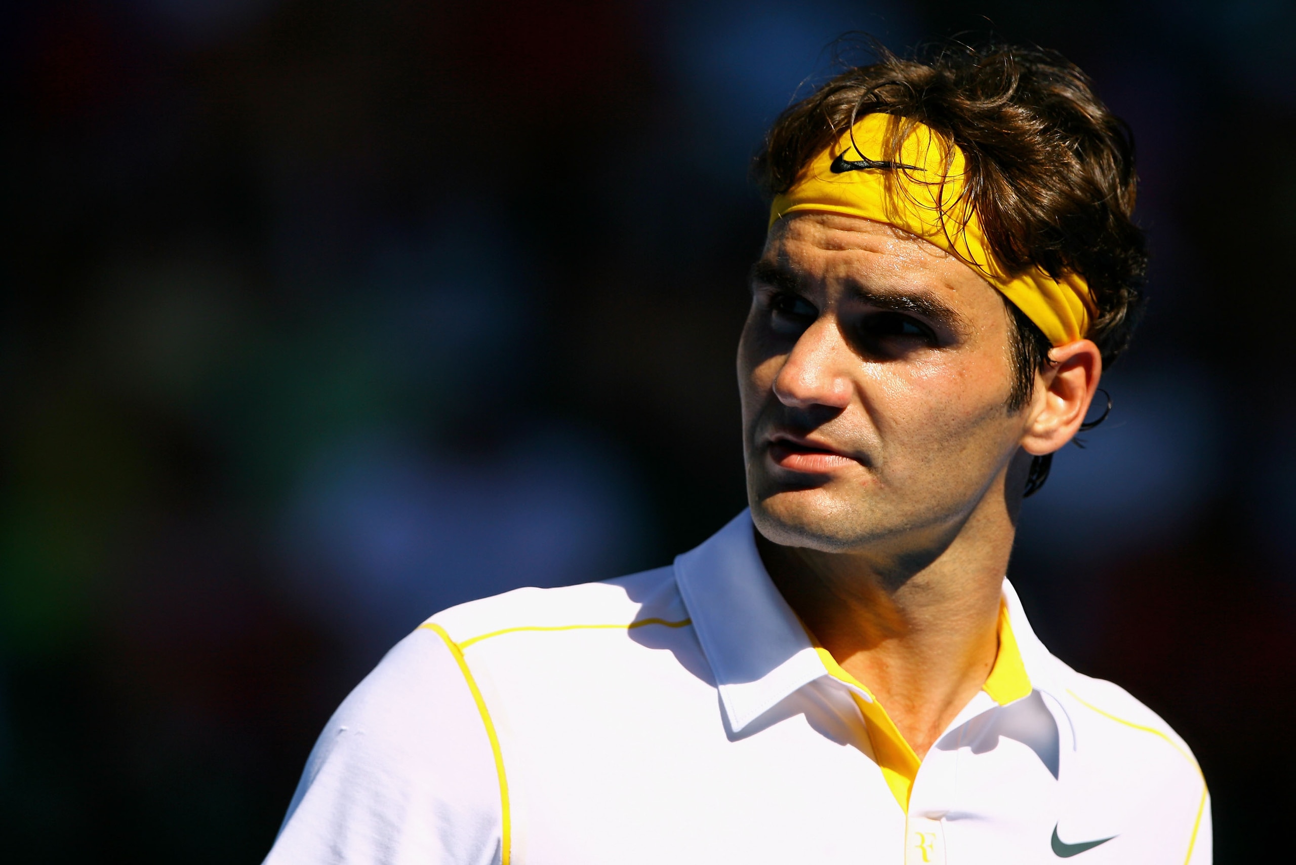 MELBOURNE, AUSTRALIA - JANUARY 23:  Roger Federer of Switzerland looks on in his fourth round match against Tommy Robredo of Spain during day seven of the 2011 Australian Open at Melbourne Park on January 23, 2011 in Melbourne, Australia.  (Photo by Rober