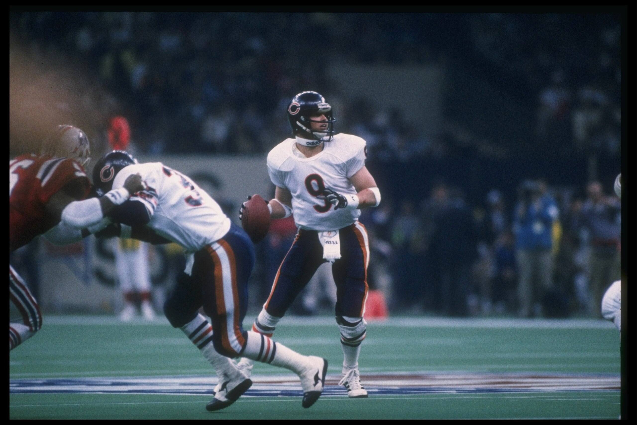 26 Jan 1986: Quarterback Jim McMahon of the Chicago Bears looks to pass the ball against the New England Patriots during Super Bowl XX at the Superdome in New Orleans, Louisiana. The Bears won the game, 46-10.