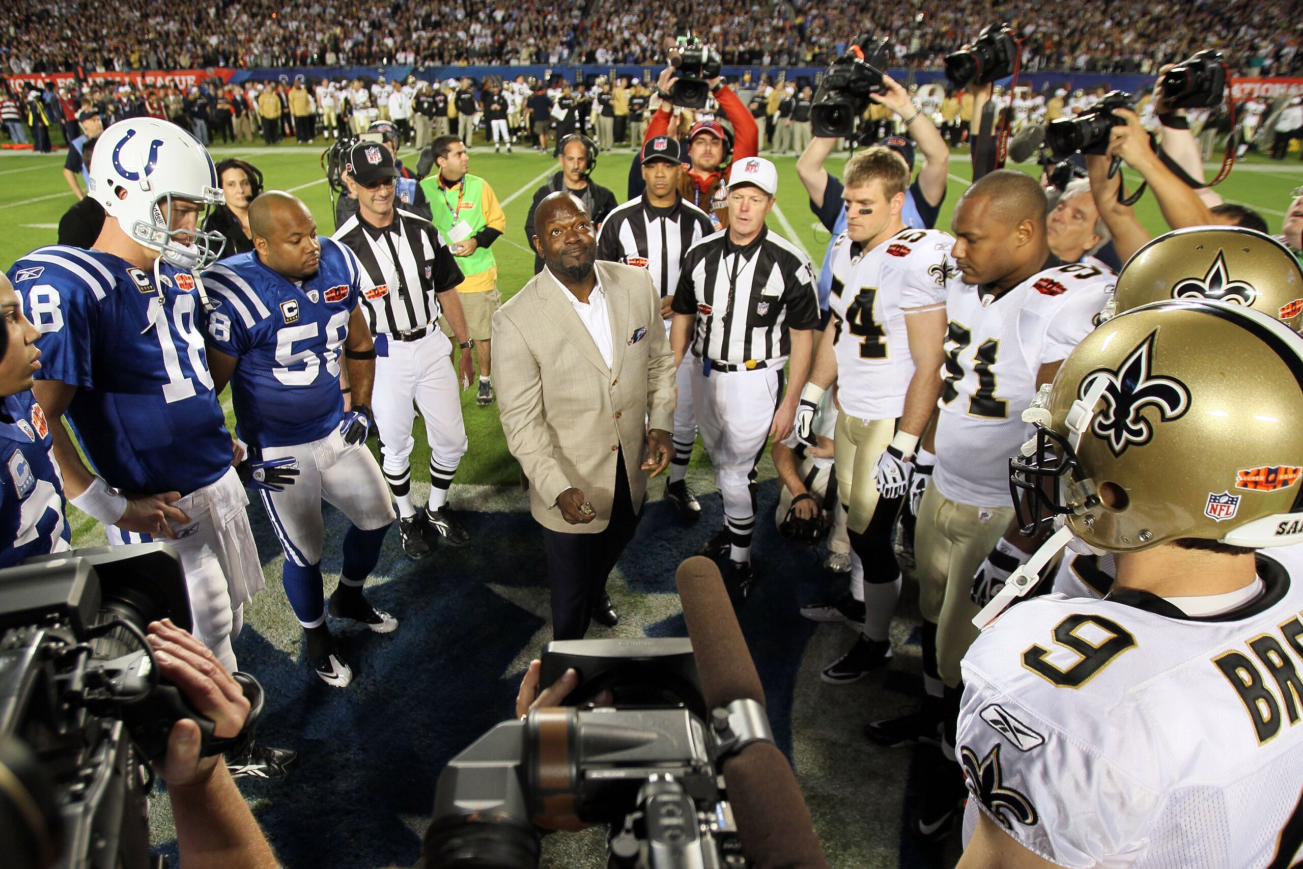 MIAMI GARDENS, FL - FEBRUARY 07: NFL Hall of Famer Emmitt Smith flips the coin prior to the start of Super Bowl XLIV between the Indianapolis Colts and the New Orleans Saints on February 7, 2010 at Sun Life Stadium in Miami Gardens, Florida.  (Photo by An