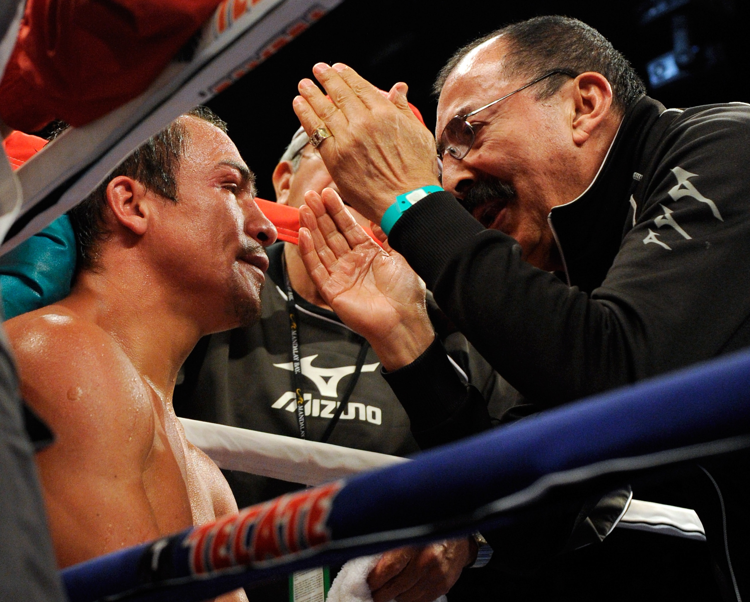 LAS VEGAS - JULY 31: WBA/WBO lightweight champion Juan Manuel Marquez (L) gets advice from his trainer Ignacio 'Nacho' Beristain between rounds during his bout against Juan Diaz at the Mandalay Bay Events Center July 31, 2010 in Las Vegas, Nevada. Marque LAS VEGAS - JULY 31: WBA/WBO lightweight champion Juan Manuel Marquez (L) gets advice from his trainer Ignacio 'Nacho' Beristain between rounds during his bout against Juan Diaz at the Mandalay Bay Events Center July 31, 2010 in Las Vegas, Nevada. Marque