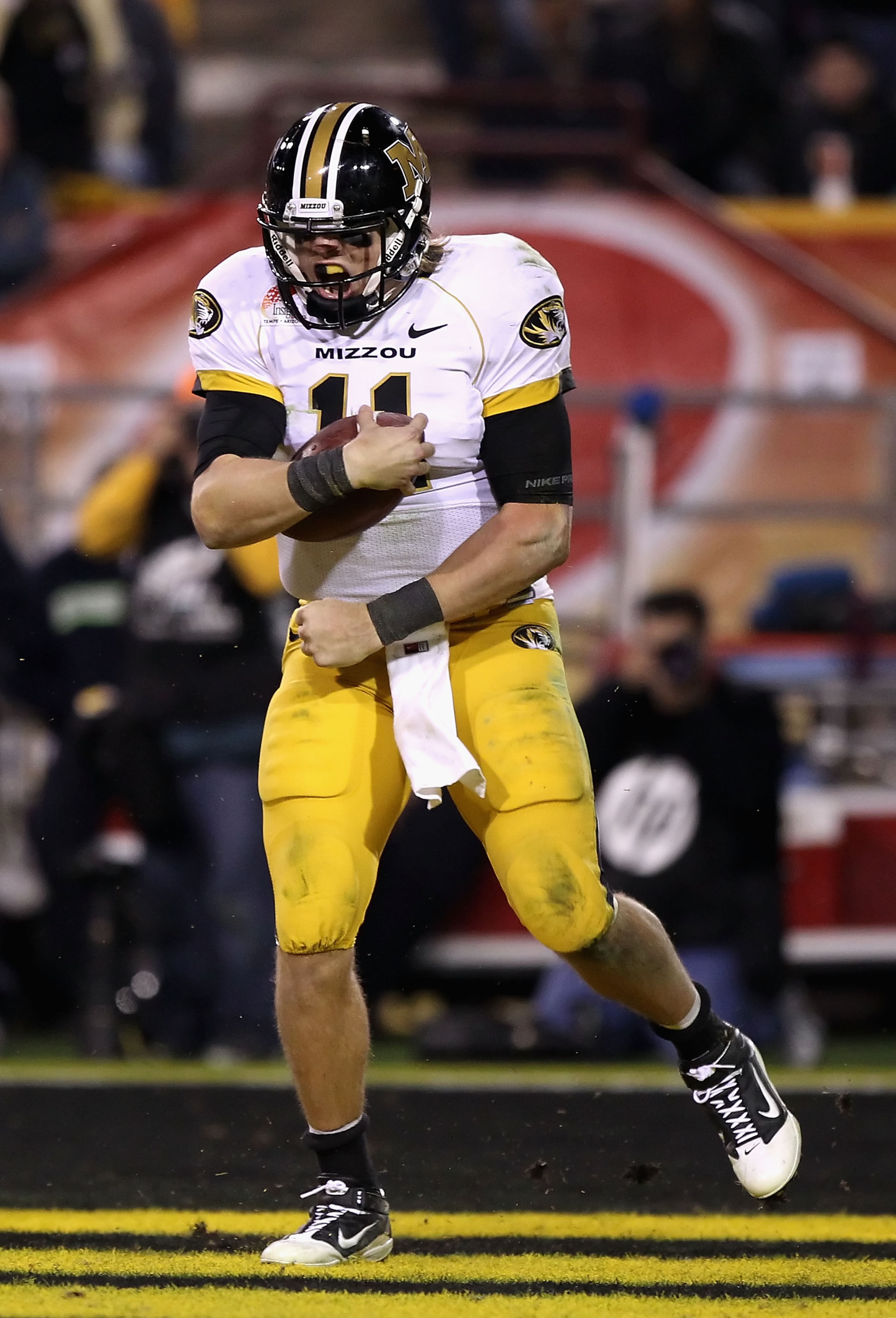 TEMPE, AZ - DECEMBER 28:  Quarterback Blaine Gabbert #11 of the Missouri Tigers celebrates after scoring a 7 yard rushing touchdown against the Iowa Hawkeyes during the third quarter of the Insight Bowl at Sun Devil Stadium on December 28, 2010 in Tempe,