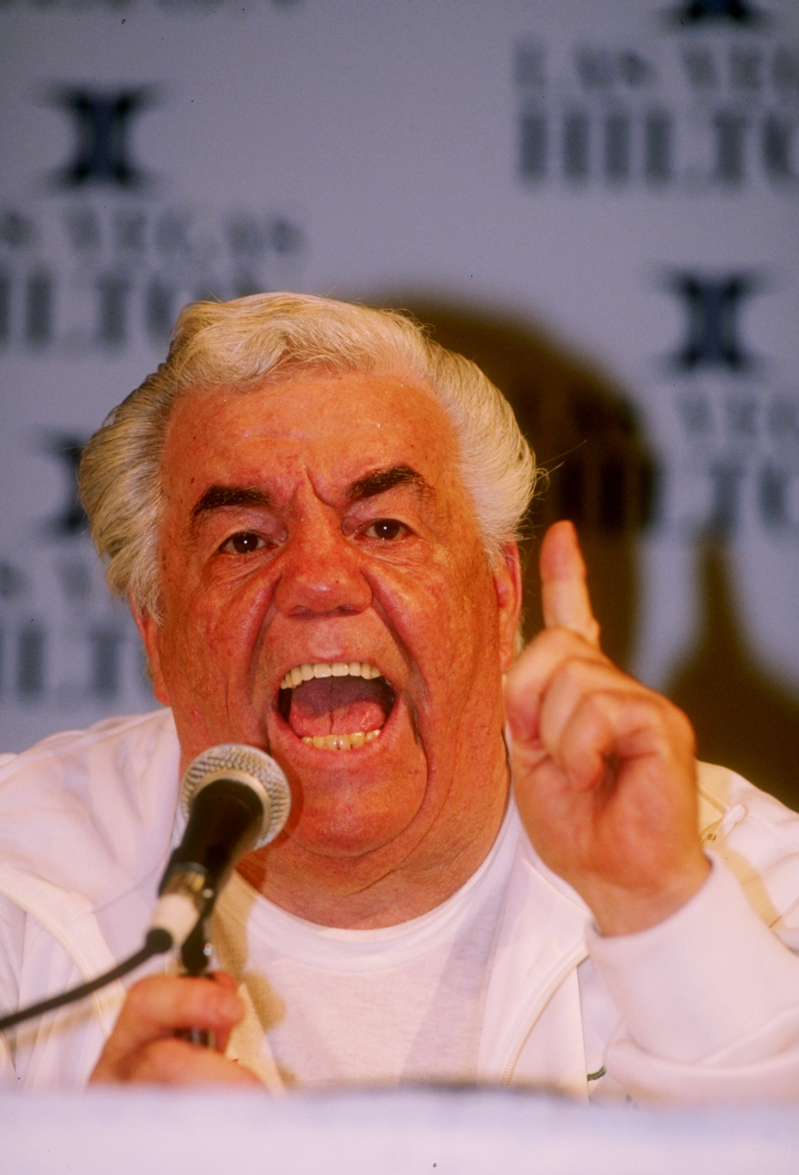 17 Mar 1990: Trainer Lou Duva shouts into a microphone during a press conference regarding his fighter Meldrick Taylor. 17 Mar 1990: Trainer Lou Duva shouts into a microphone during a press conference regarding his fighter Meldrick Taylor.