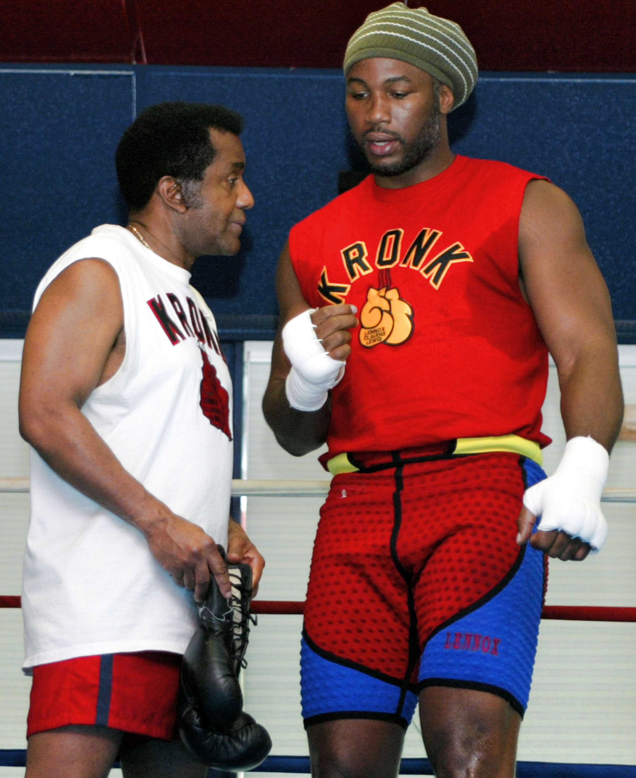 SCOTRUN, PA MAY 29: Lennox Lewis (r) and his trainer Emanuel Steward (l) speak before a sparing session at his training camp on May 29, 2003 in Scotrun, Pennsylvania. Lewis is training for is upcoming WBC title defense against Kirk Johnson on June 21, 2 SCOTRUN, PA MAY 29: Lennox Lewis (r) and his trainer Emanuel Steward (l) speak before a sparing session at his training camp on May 29, 2003 in Scotrun, Pennsylvania. Lewis is training for is upcoming WBC title defense against Kirk Johnson on June 21, 2