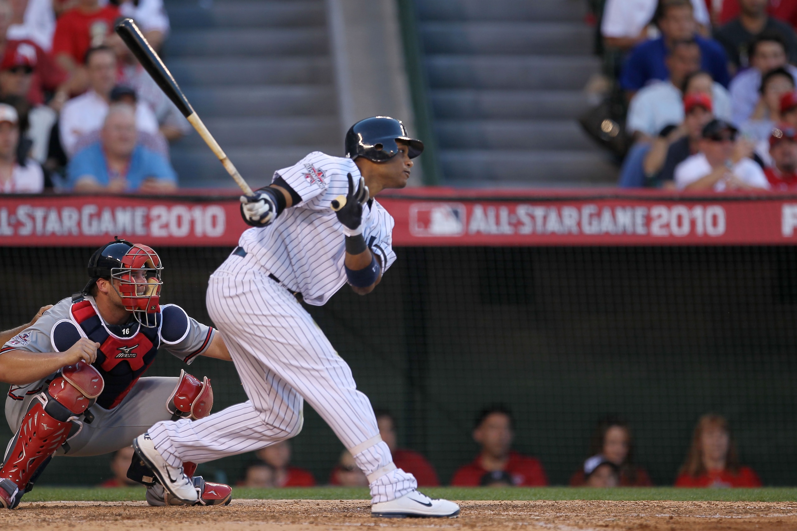 ANAHEIM, CA - JULY 13:  American League All-Star Robinson Cano #24 of the New York Yankees hits a sacrifice fly to score American League All-Star Evan Longoria #3 of the Tampa Bay Rays in the fifth inning during the 81st MLB All-Star Game at Angel Stadium