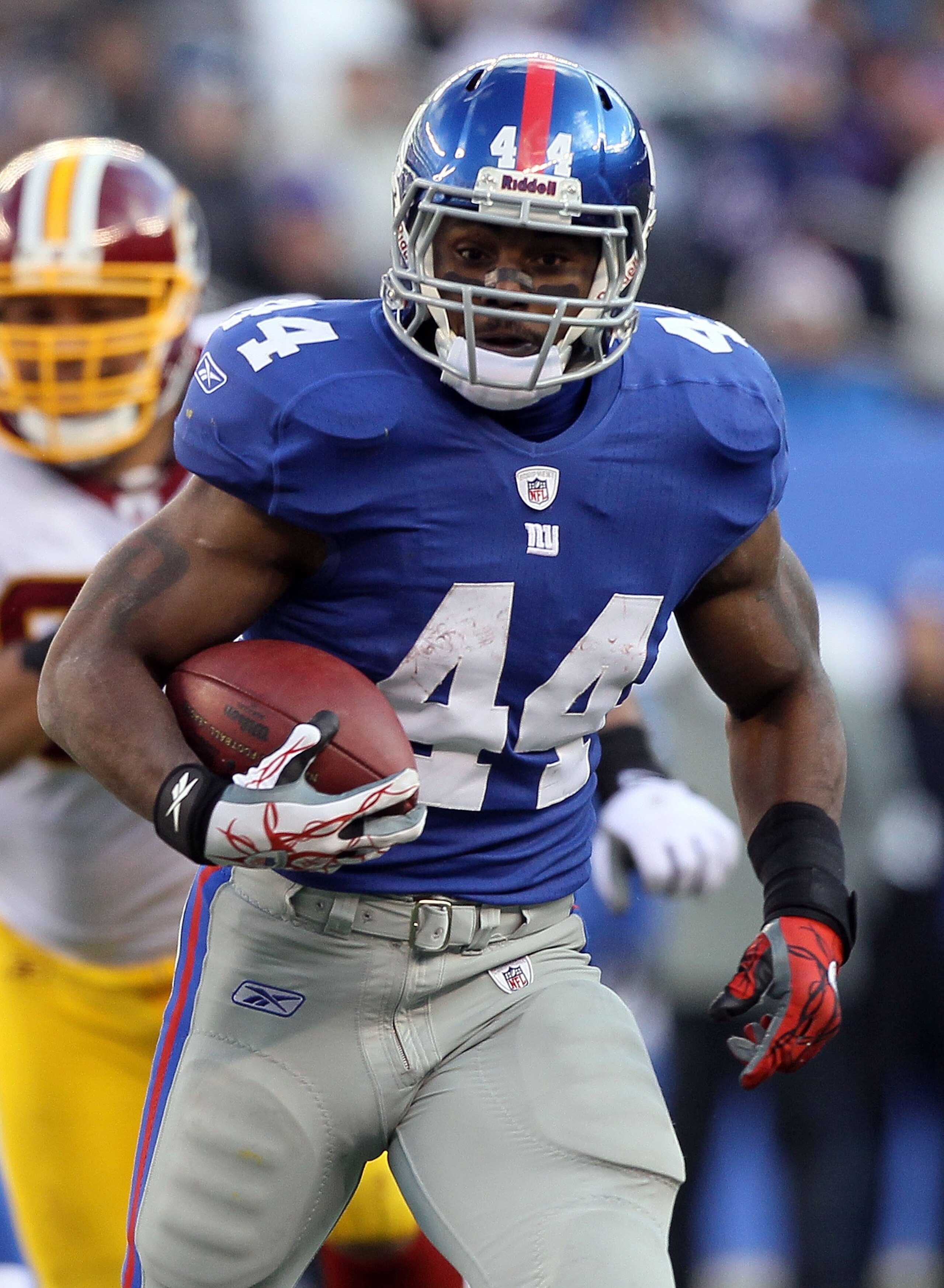 EAST RUTHERFORD, NJ - DECEMBER 05:  Ahmad Bradshaw #44 of the New York Giants runs the ball against the Washington Redskins on December 5, 2010 at the New Meadowlands Stadium in East Rutherford, New Jersey. The Giants defeated the Redskins 31-7.  (Photo b