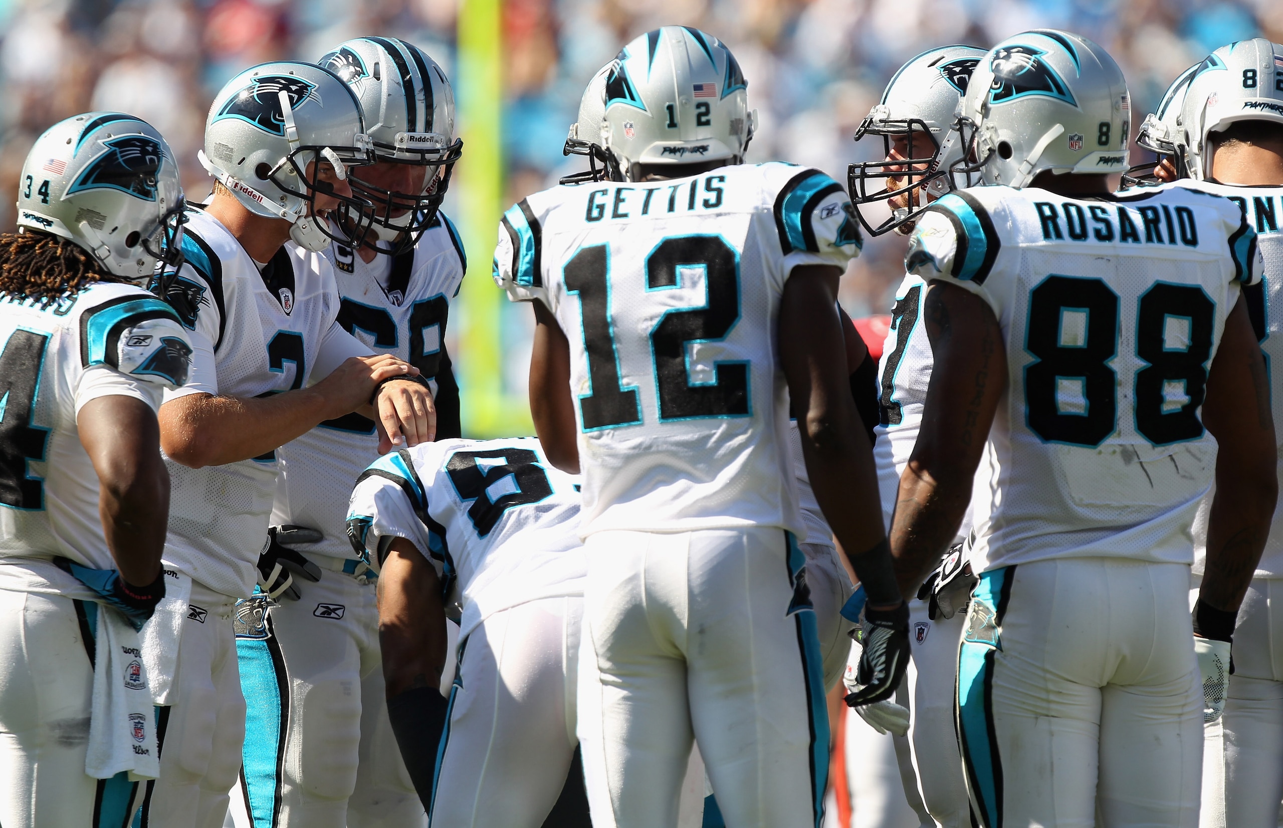 CHARLOTTE, NC - SEPTEMBER 19:  Jimmy Clausen #2 of the Carolina Panthers calls a play in the huddle against the Tampa Bay Buccaneers during their game at Bank of America Stadium on September 19, 2010 in Charlotte, North Carolina.  (Photo by Streeter Lecka