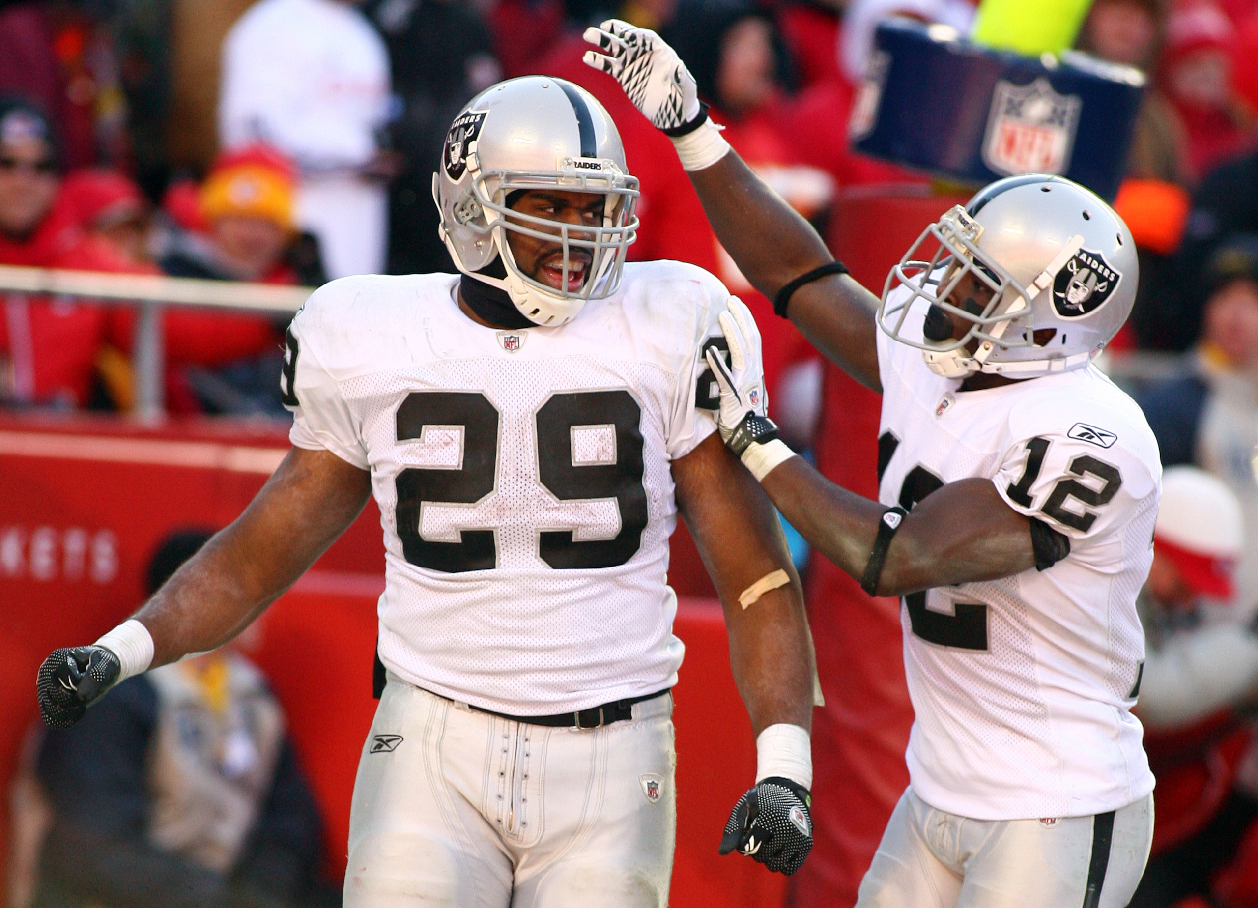 KANSAS CITY, MO - JANUARY 02: Running back Michael Bush #29 of the Oakland Raiders is congratulated by wide receiver Jacoby Ford #12 after scoring a touchdown in a game against the Kansas City Chiefs at Arrowhead Stadium on January 2, 2011 in Kansas City KANSAS CITY, MO - JANUARY 02: Running back Michael Bush #29 of the Oakland Raiders is congratulated by wide receiver Jacoby Ford #12 after scoring a touchdown in a game against the Kansas City Chiefs at Arrowhead Stadium on January 2, 2011 in Kansas City