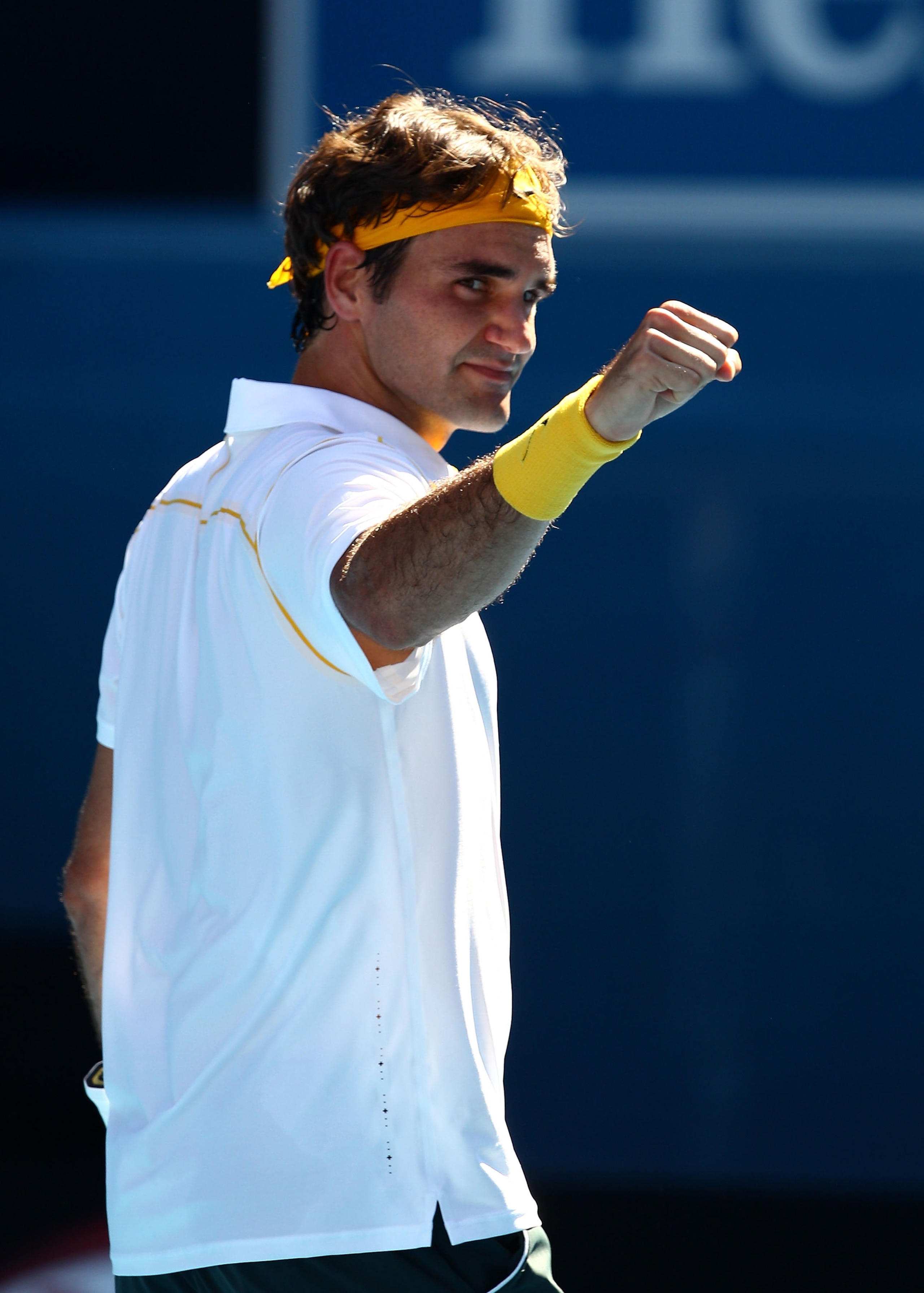 MELBOURNE, AUSTRALIA - JANUARY 23:  Roger Federer of Switzerland celebrates winning in his fourth round match against Tommy Robredo of Spain during day seven of the 2011 Australian Open at Melbourne Park on January 23, 2011 in Melbourne, Australia.  (Phot
