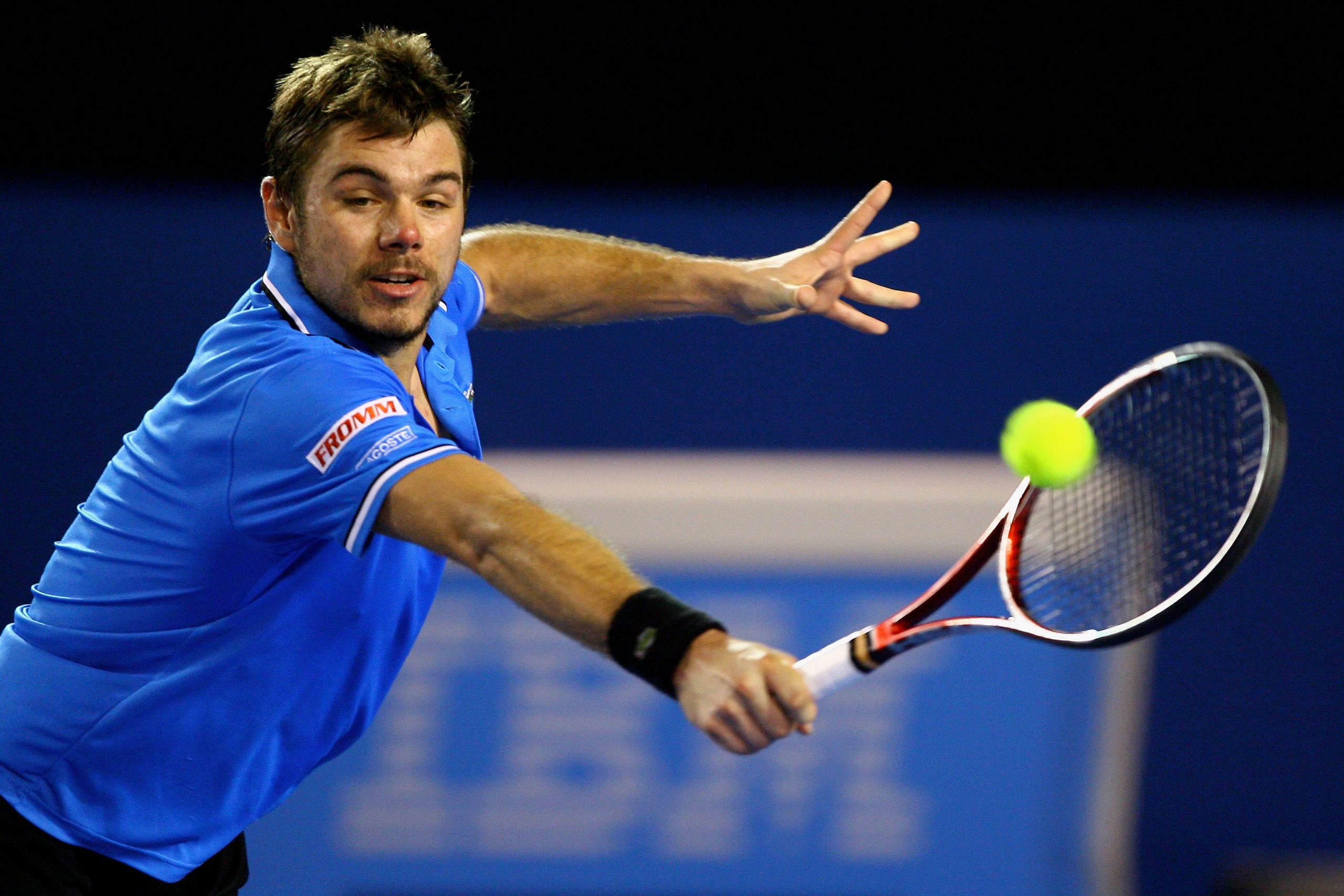 MELBOURNE, AUSTRALIA - JANUARY 23:  Stanislas Wawrinka of Switzerland plays a backhand in his fourth round match against Andy Roddick of the United States of America during day seven of the 2011 Australian Open at Melbourne Park on January 23, 2011 in Mel