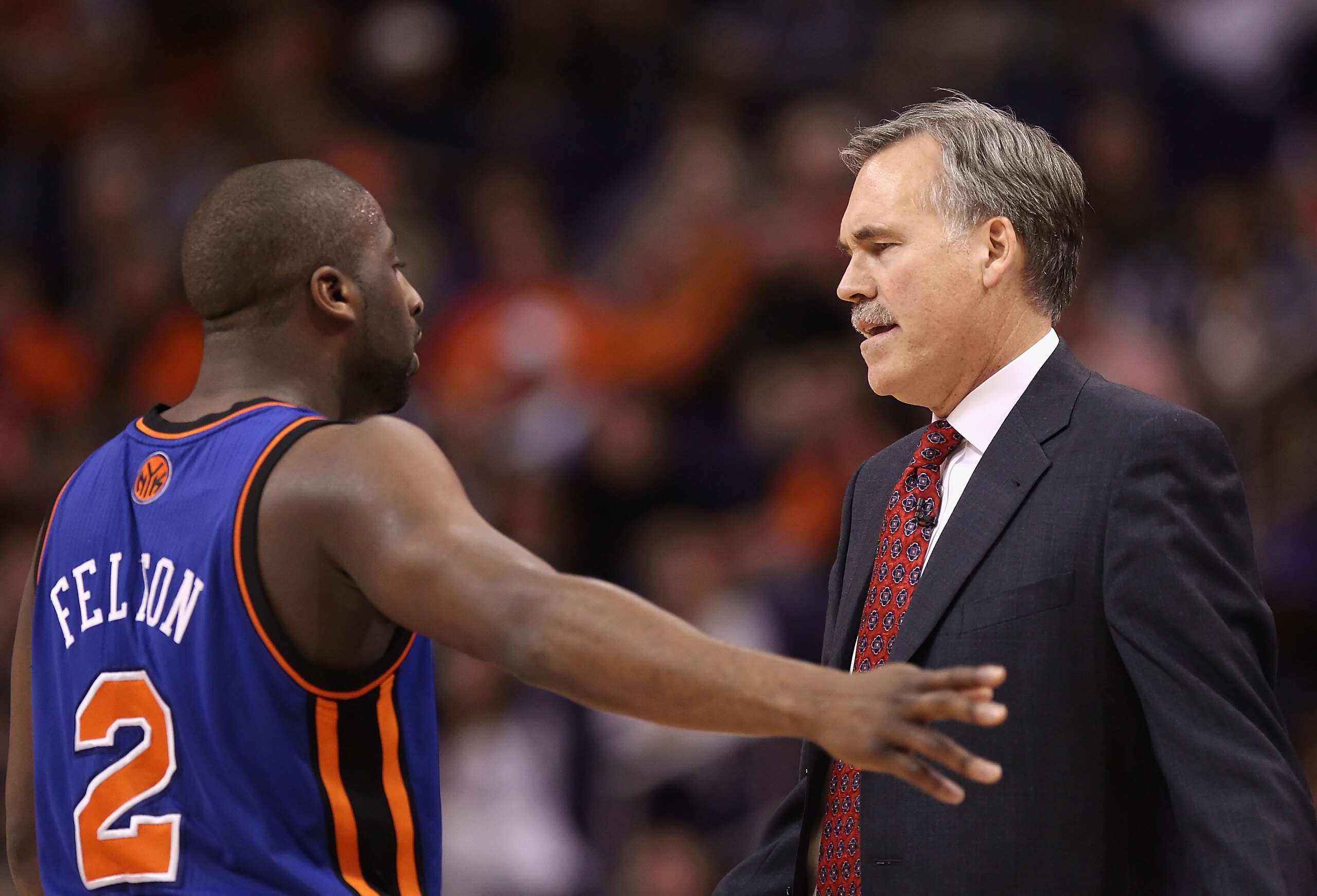 PHOENIX, AZ - JANUARY 07:  Head coach Mike D'Antoni of the New York Knicks talks with Raymond Felton #2 during the NBA game against the Phoenix Suns at US Airways Center on January 7, 2011 in Phoenix, Arizona.  The Knicks defeated the Suns 121-96.  NOTE T