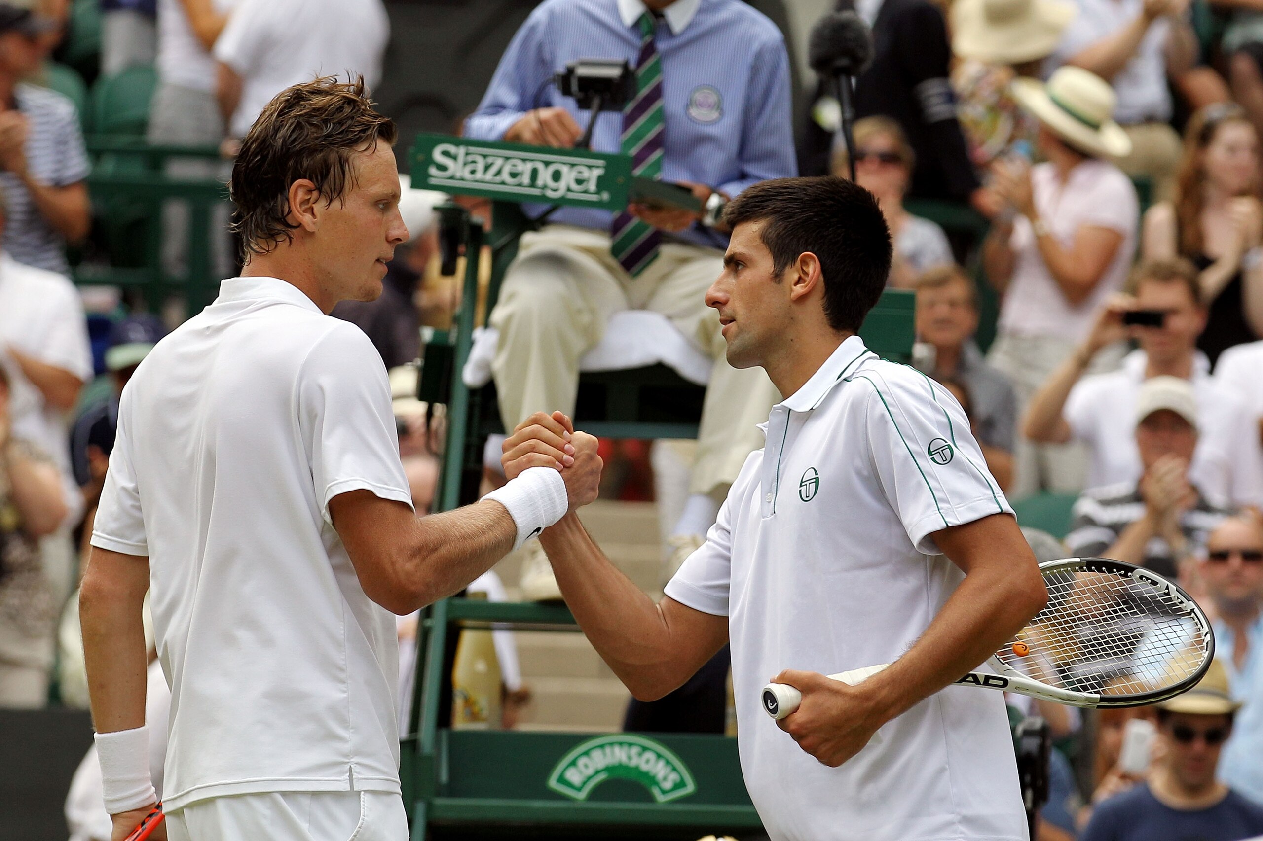 LONDON, ENGLAND - JULY 02:  Tomas Berdych of Czech Republic (L) shakes hands after winning the Menï¿½s Semi Final match against Novak Djokovic of Serbia on Day Eleven of the Wimbledon Lawn Tennis Championships at the All England Lawn Tennis and Croquet Club