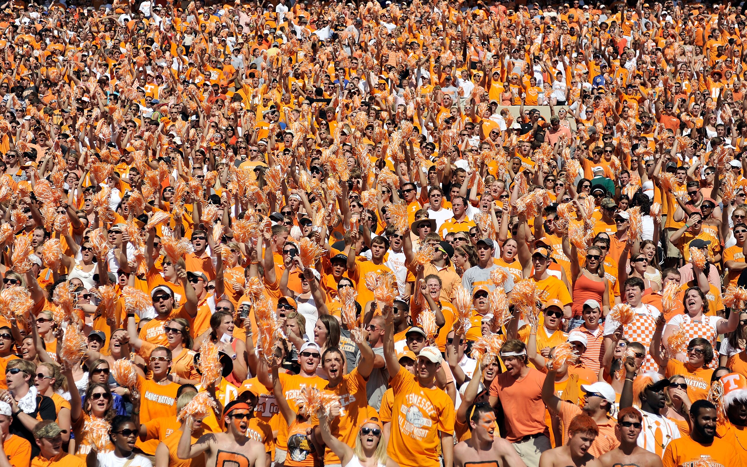 KNOXVILLE, TN - SEPTEMBER 18:  Orange-clad Tennessee Volunteers fans sing along with 'Rocky Top' during a game against the Florida Gators at Neyland Stadium on September 18, 2010 in Knoxville, Tennessee. Florida won 31-17.  (Photo by Grant Halverson/Getty