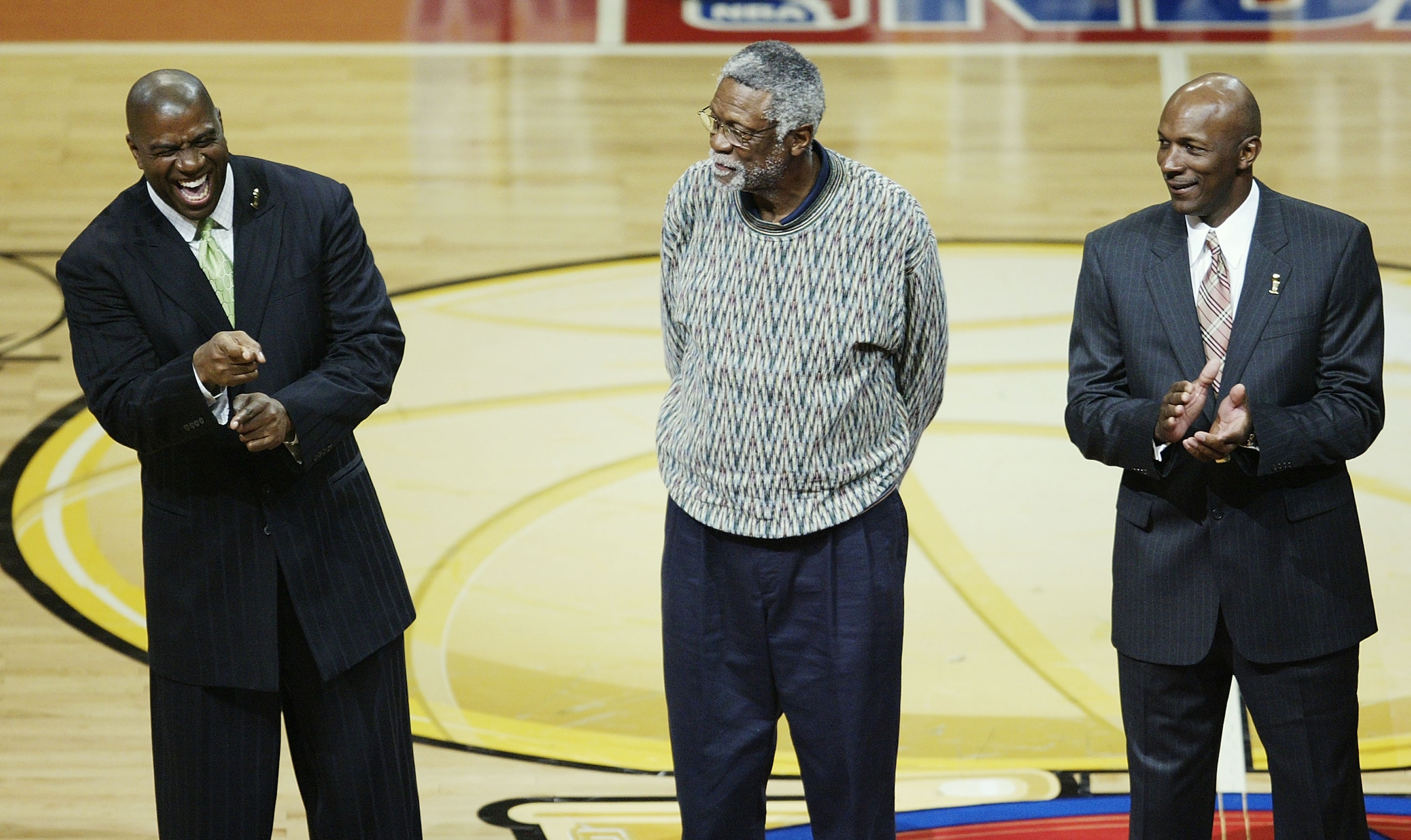 AUBURN HILLS, MI - JUNE 16:  NBA greats (L-R) Magic Johnson, Bill Russell and Clyde Drexler are introduced in the first quarter as the San Antonio Spurs take on the Detroit Pistons in Game four of the 2005 NBA Finals at The Palace of Auburn Hills on June