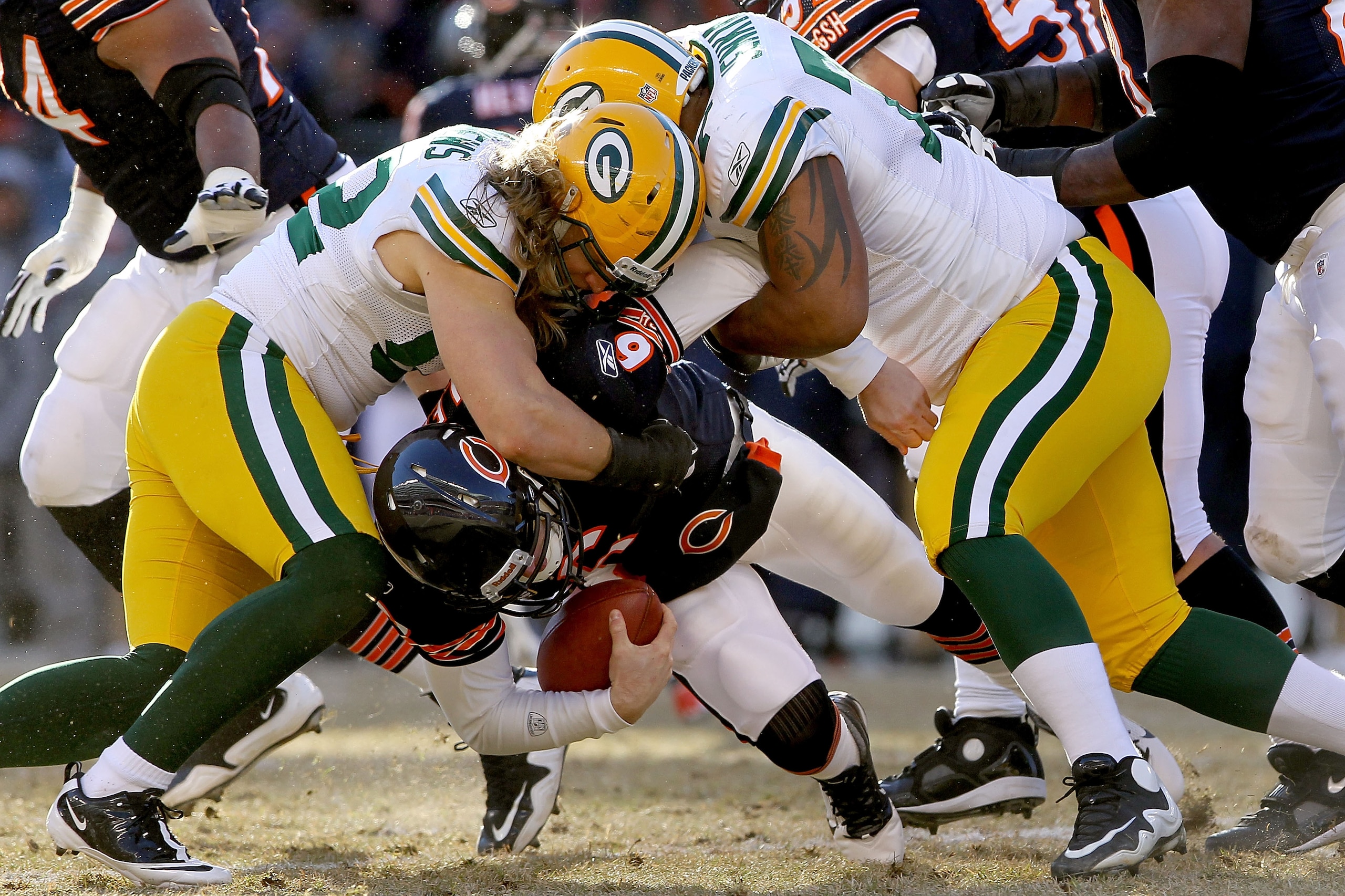 CHICAGO, IL - JANUARY 23: Linebacker Clay Matthews #52 and Cullen Jenkins #77 of the Green Bay Packers sack quarterback Jay Cutler #6 of the Chicago Bears in the first half of the NFC Championship Game at Soldier Field on January 23, 2011 in Chicago, Ill CHICAGO, IL - JANUARY 23: Linebacker Clay Matthews #52 and Cullen Jenkins #77 of the Green Bay Packers sack quarterback Jay Cutler #6 of the Chicago Bears in the first half of the NFC Championship Game at Soldier Field on January 23, 2011 in Chicago, Ill