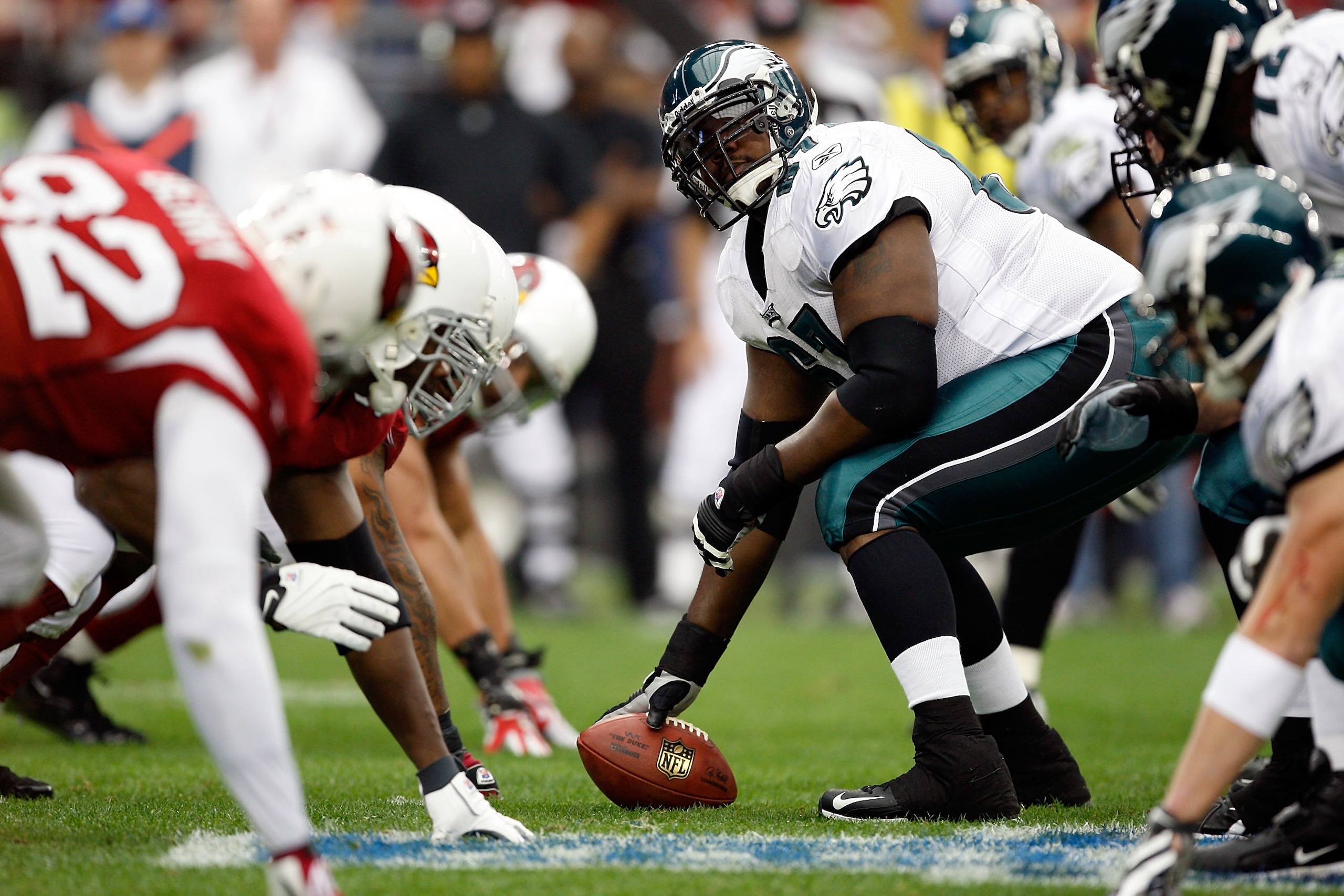 GLENDALE, AZ - JANUARY 18:  Center Jamaal Jackson #67 of the Philadelphia Eagles looks over as he prepares to hike the ball during the NFC championship game against the Arizona Cardinals on January 18, 2009 at University of Phoenix Stadium in Glendale, Ar