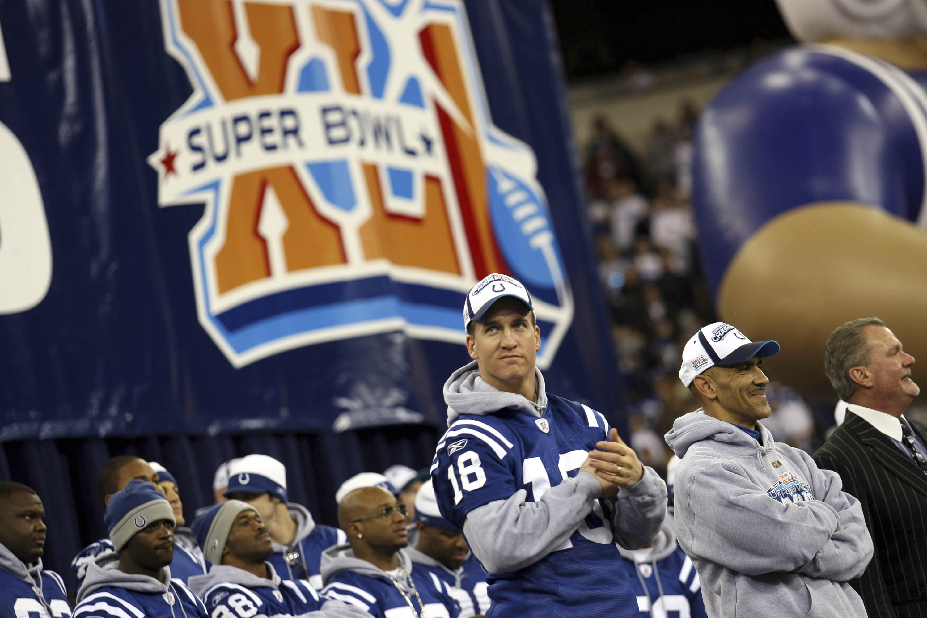 INDIANAPOLIS - FEBRUARY 5:  (R-L) Indianapolis Colts owner Jim Irsay, Head Coach Tony Dungy and Quarterback Peyton Manning lead the celebration of their victory at a rally after the Colts beat the Chicago Bears in Super Bowl XLI Sunday in Miami at the RCA