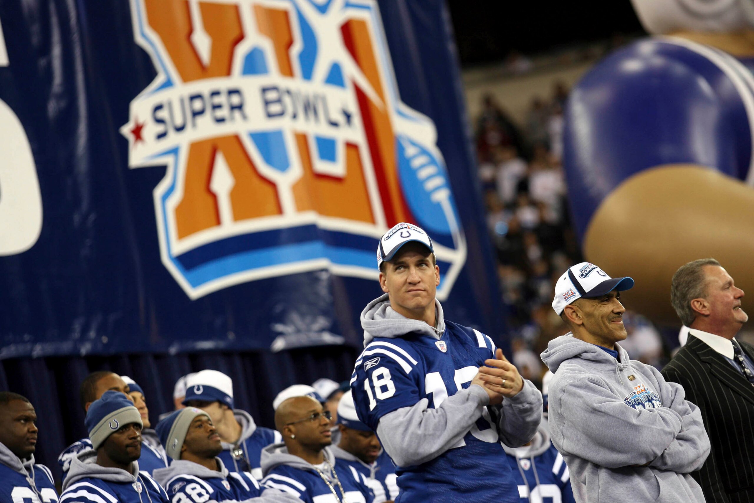 INDIANAPOLIS - FEBRUARY 5:  (R-L) Indianapolis Colts owner Jim Irsay, Head Coach Tony Dungy and Quarterback Peyton Manning lead the celebration of their victory at a rally after the Colts beat the Chicago Bears in Super Bowl XLI Sunday in Miami at the RCA