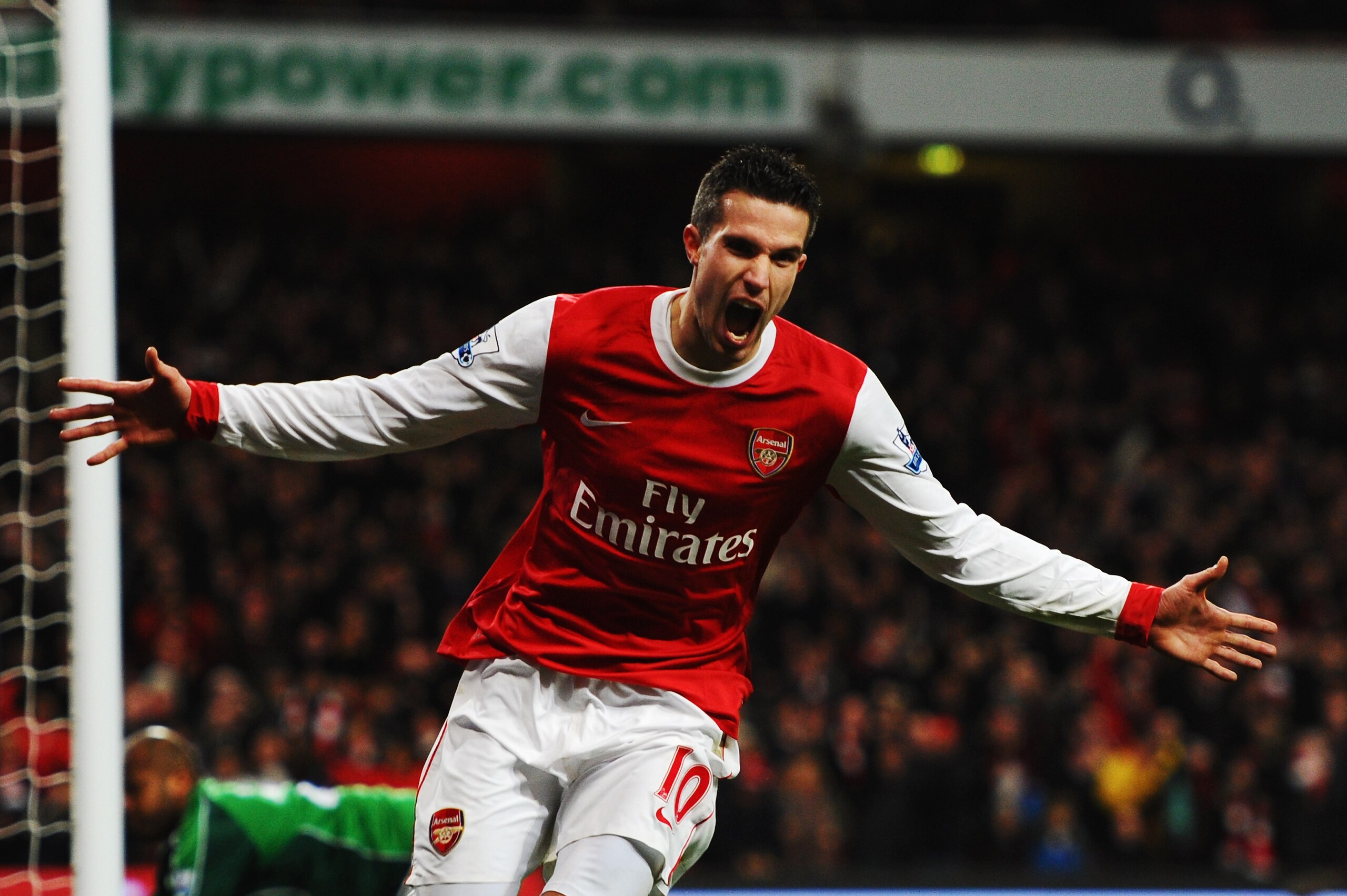 LONDON, UNITED KINGDOM - JANUARY 22:  Robin Van Persie of Arsenal celebrates scoring his third goal in a hat trick during the Barclays Premier League match between Arsenal and Wigan Athletic at the Emirates Stadium on January 22, 2011 in London, England.