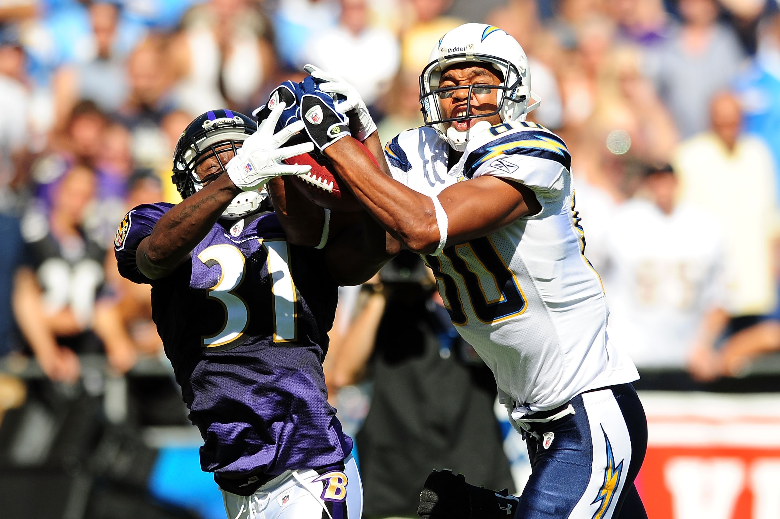 SAN DIEGO - SEPTEMBER 20:Malcolm Floyd #80 of the San Diego Chargers and Fabian Washington #31 of the Baltimore Ravens both catch the ball at Qualcomm Stadium on September 20, 2009 in San Diego, California. (Photo by Jacob de Golish/Getty Images) SAN DIEGO - SEPTEMBER 20:Malcolm Floyd #80 of the San Diego Chargers and Fabian Washington #31 of the Baltimore Ravens both catch the ball at Qualcomm Stadium on September 20, 2009 in San Diego, California. (Photo by Jacob de Golish/Getty Images)
