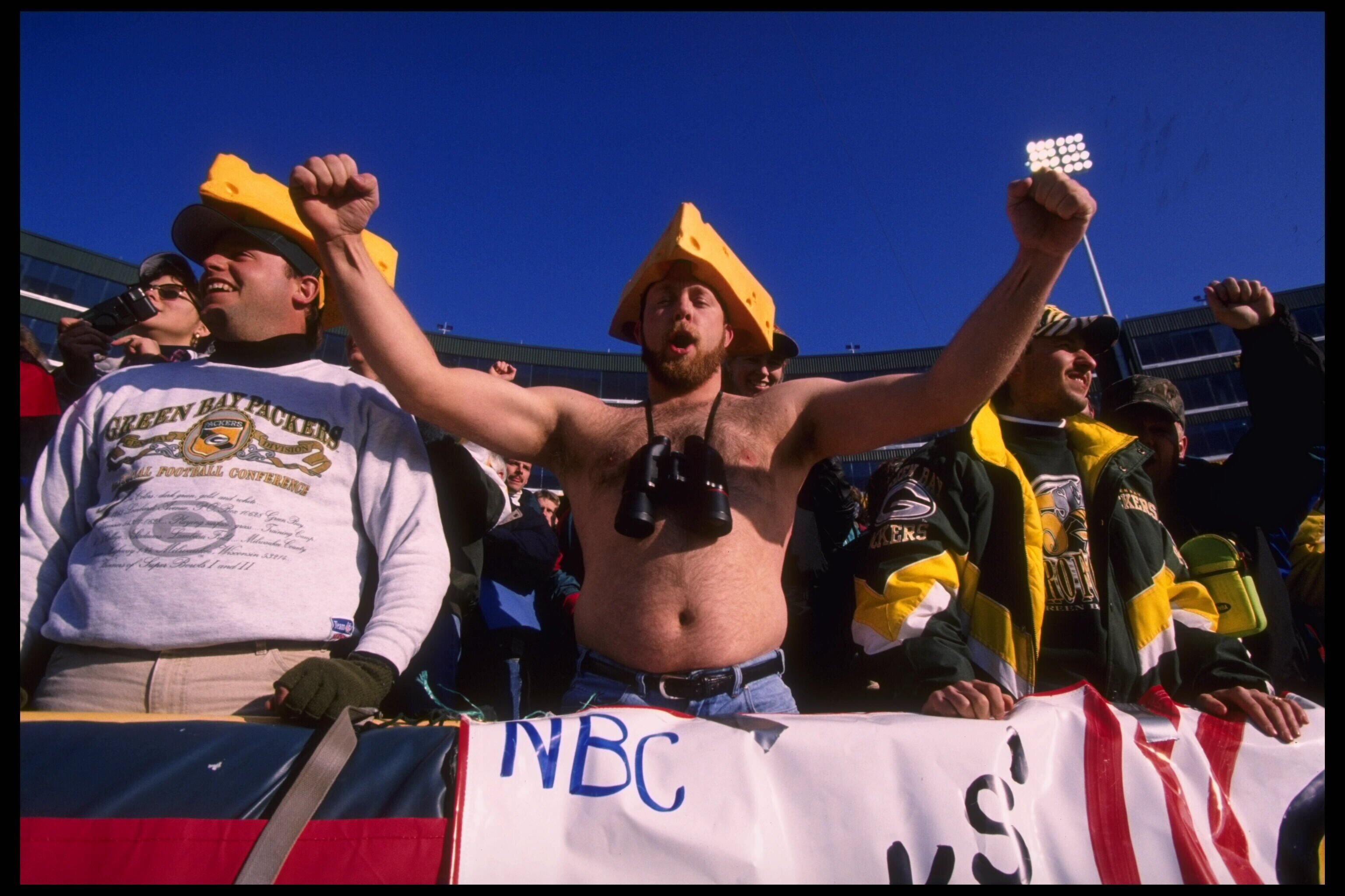 Special to the New York Times: File Photo:Bay Packers fans hoot n holler with cheese on their heads as their team faces the Cincinnati Bengals at Lambeau Field in Green Bay, Wisconsin.  The Packers defeated the Bengals 24-10.  Mandatory Credit:  Jonathan