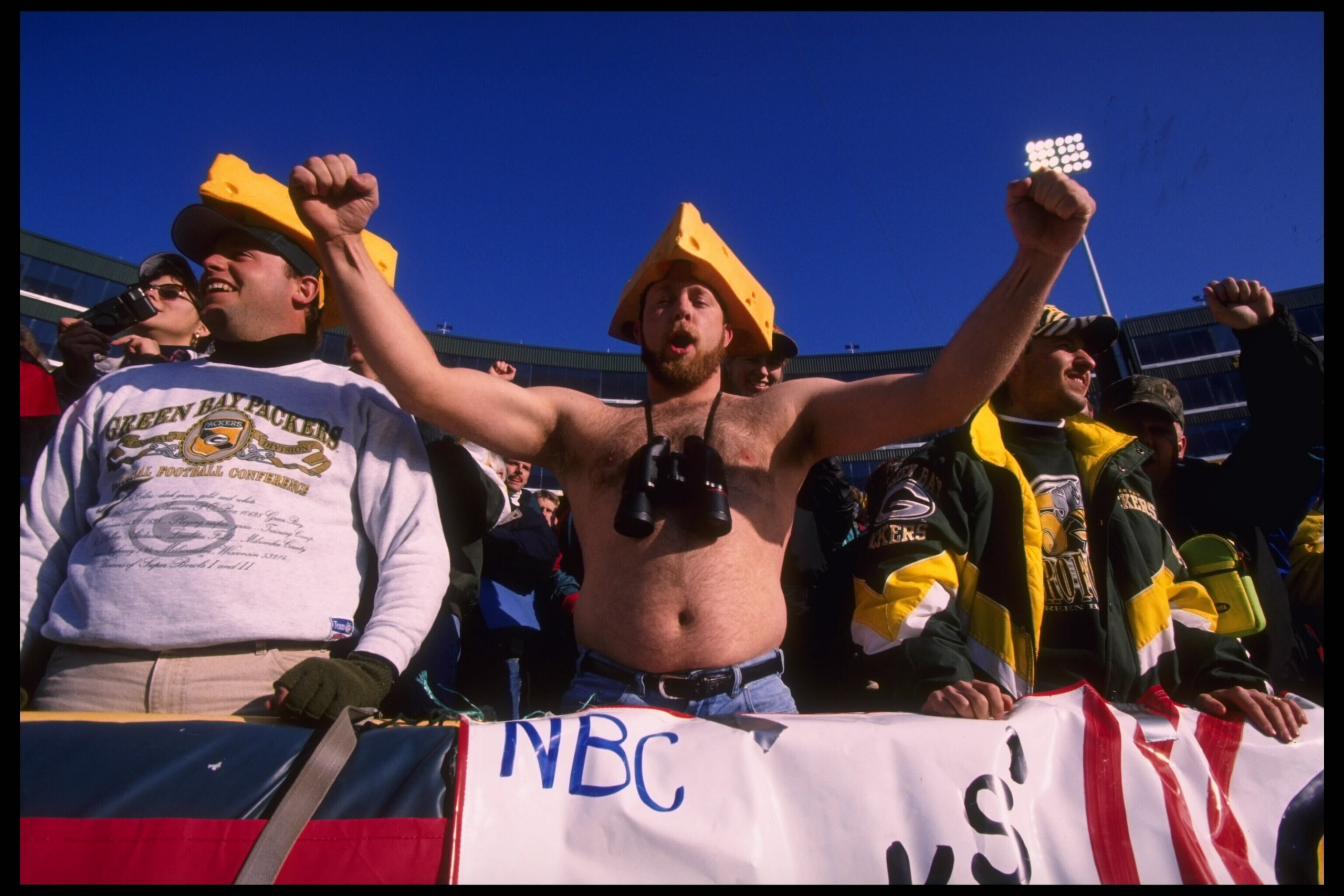 Special to the New York Times: File Photo:Bay Packers fans hoot n holler with cheese on their heads as their team faces the Cincinnati Bengals at Lambeau Field in Green Bay, Wisconsin.  The Packers defeated the Bengals 24-10.  Mandatory Credit:  Jonathan