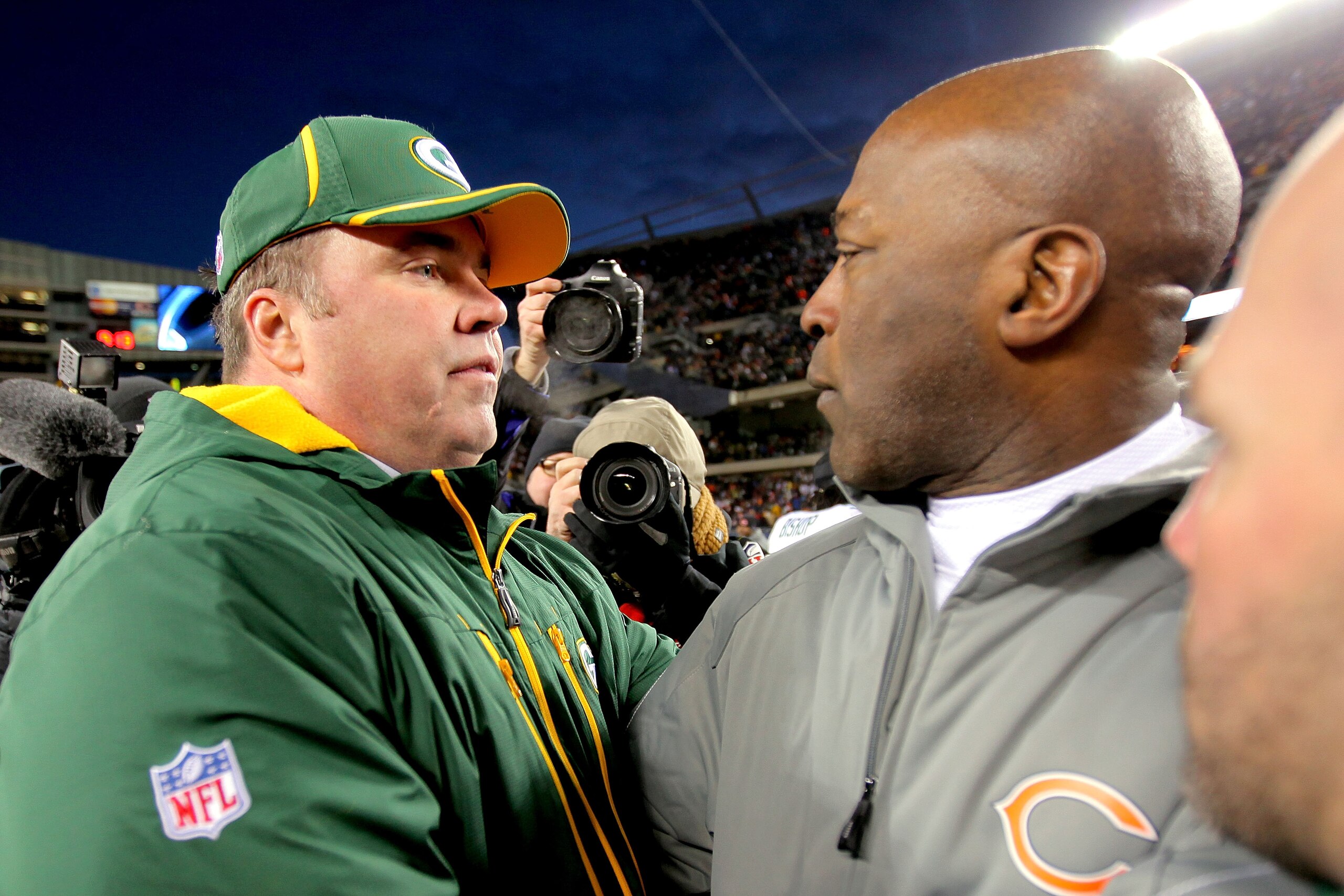 CHICAGO, IL - JANUARY 23:  Head coach Mike McCarthy of the Green Bay Packers and head coach Lovie Smith of the Chicago Bears shake hands after the Packers 21-14 victory in the NFC Championship Game at Soldier Field on January 23, 2011 in Chicago, Illinois