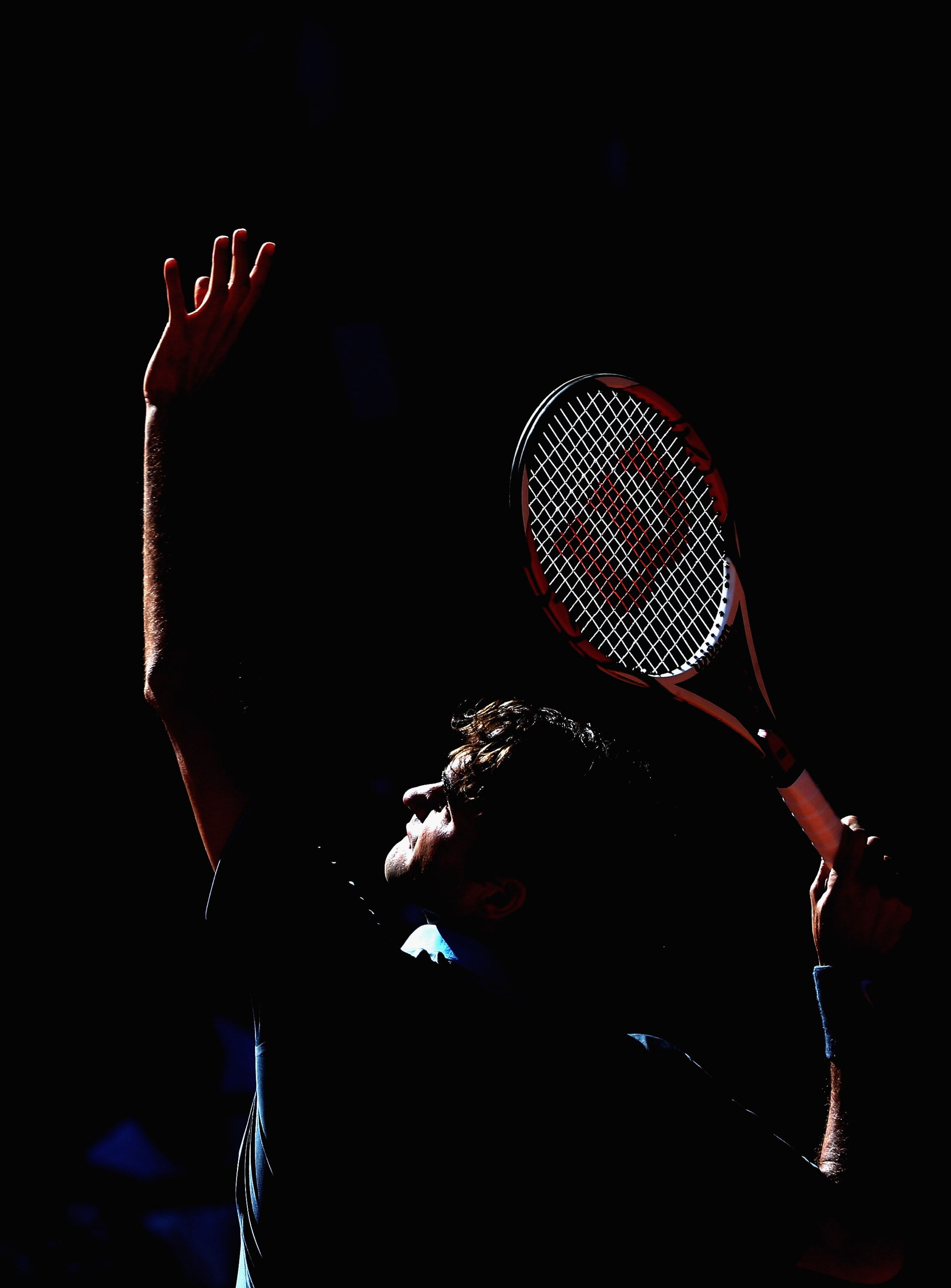 MADRID, SPAIN - MAY 17:  Roger Federer of Switzerland serves against Rafael Nadal of Spain in the mens final during the Madrid Open tennis tournament at the Caja Magica on May 17, 2009 in Madrid, Spain.  (Photo by Clive Brunskill/Getty Images)