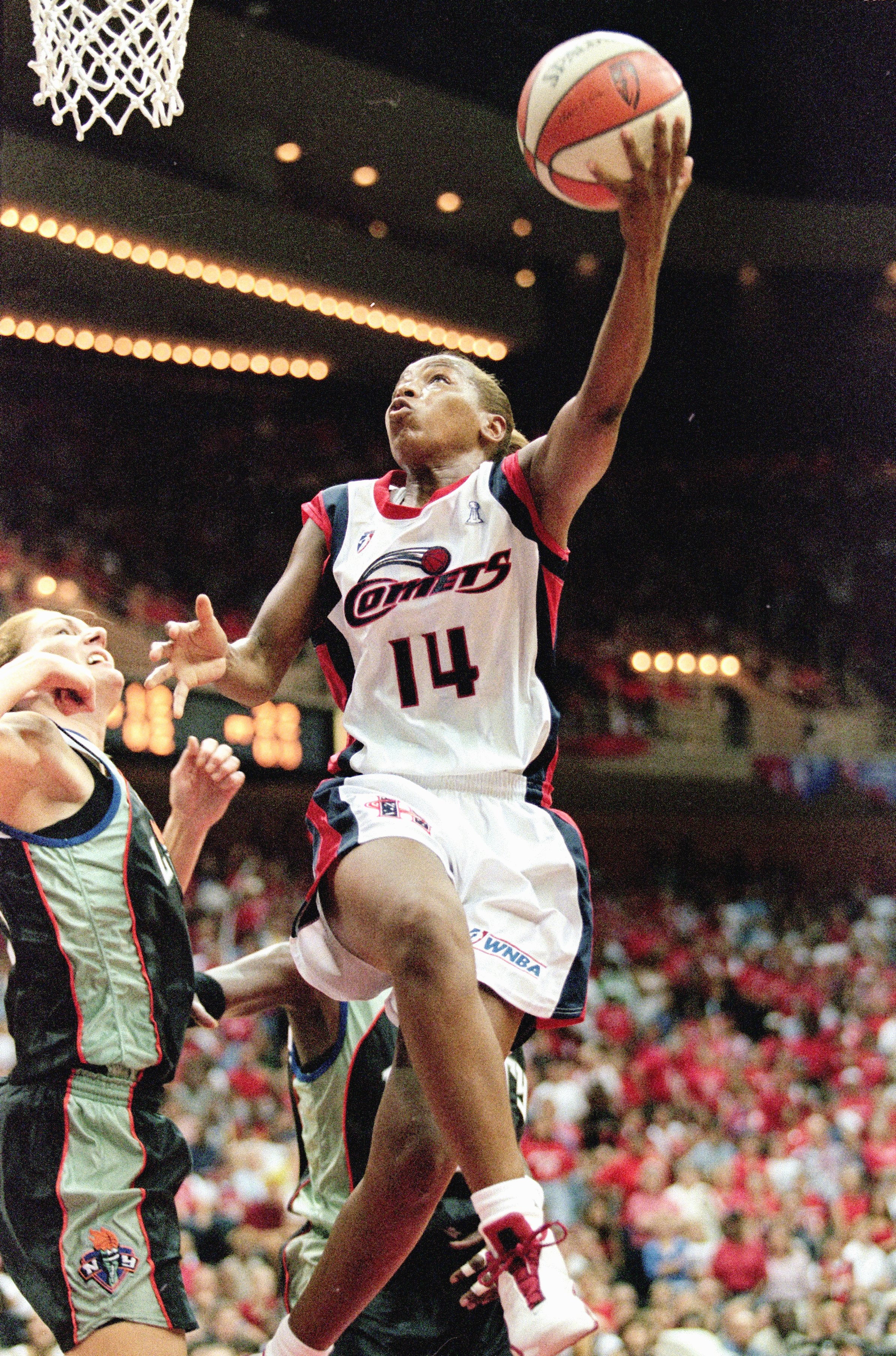 26 Aug 2000:  Cynthia Cooper #14 of the Houston Comets makes a layup during the game against the New York Liberty at the Compaq Center in Houston, Texas. The Comets defeated the Liberty 79-73.   NOTE TO USER: It is expressly understood that the only right