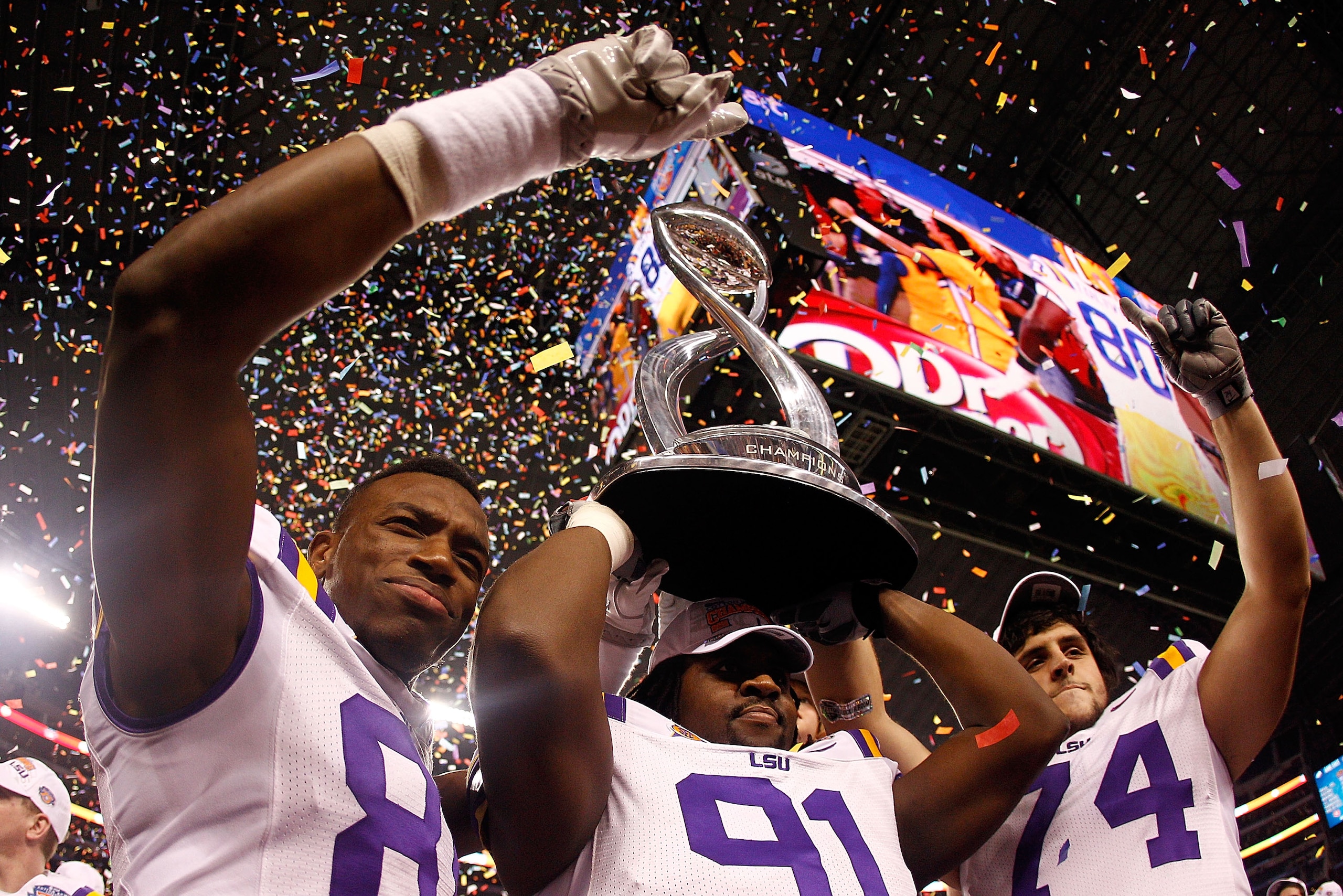 ARLINGTON, TX - JANUARY 07: Members of the Louisiana State University Tigers celebrate after defeating the Texas A&M Aggies 41-24 during the AT&T Cotton Bowl at Cowboys Stadium on January 7, 2011 in Arlington, Texas. (Photo by Chris Graythen/Getty Image ARLINGTON, TX - JANUARY 07: Members of the Louisiana State University Tigers celebrate after defeating the Texas A&M Aggies 41-24 during the AT&T Cotton Bowl at Cowboys Stadium on January 7, 2011 in Arlington, Texas. (Photo by Chris Graythen/Getty Image